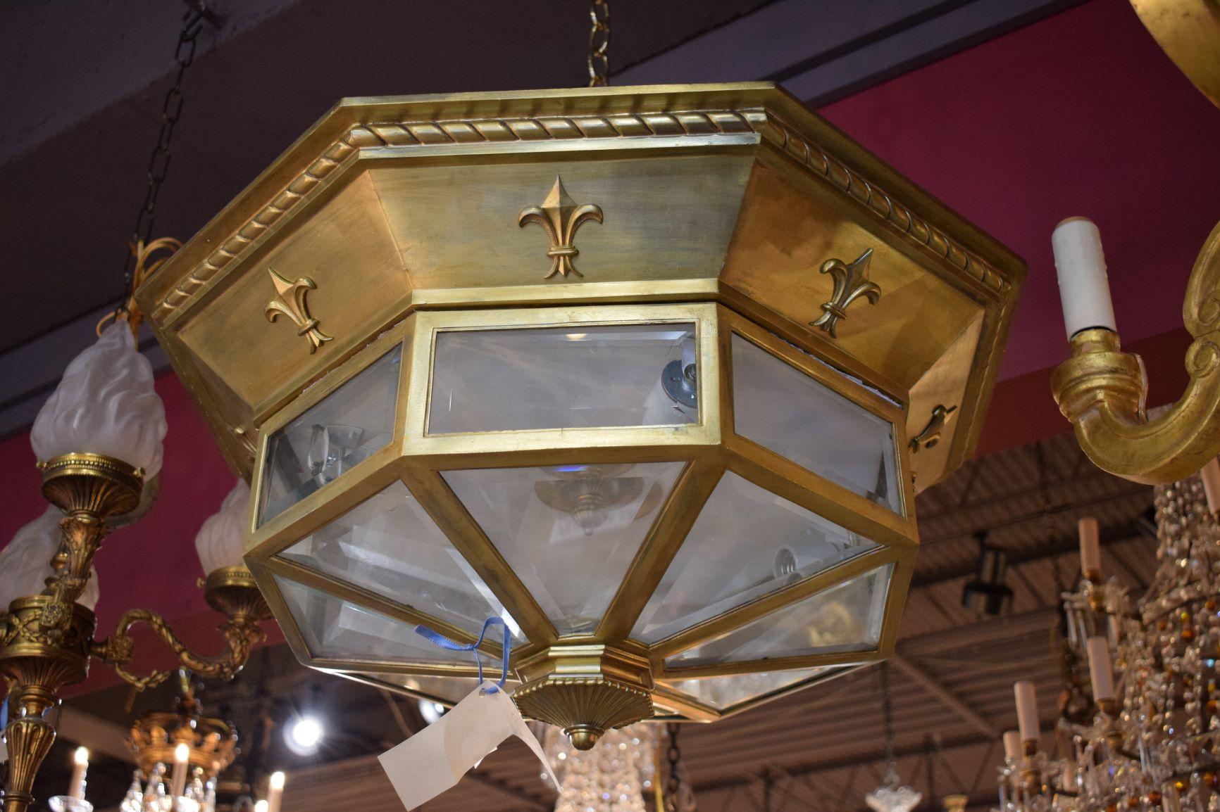 A very fine Art Deco flushmounted pendant (Plafonnier). Gilt bronze with beveled crystal panels.
France, circa 1935. 5-light. Several available.
Dimensions: Height 13 1/2