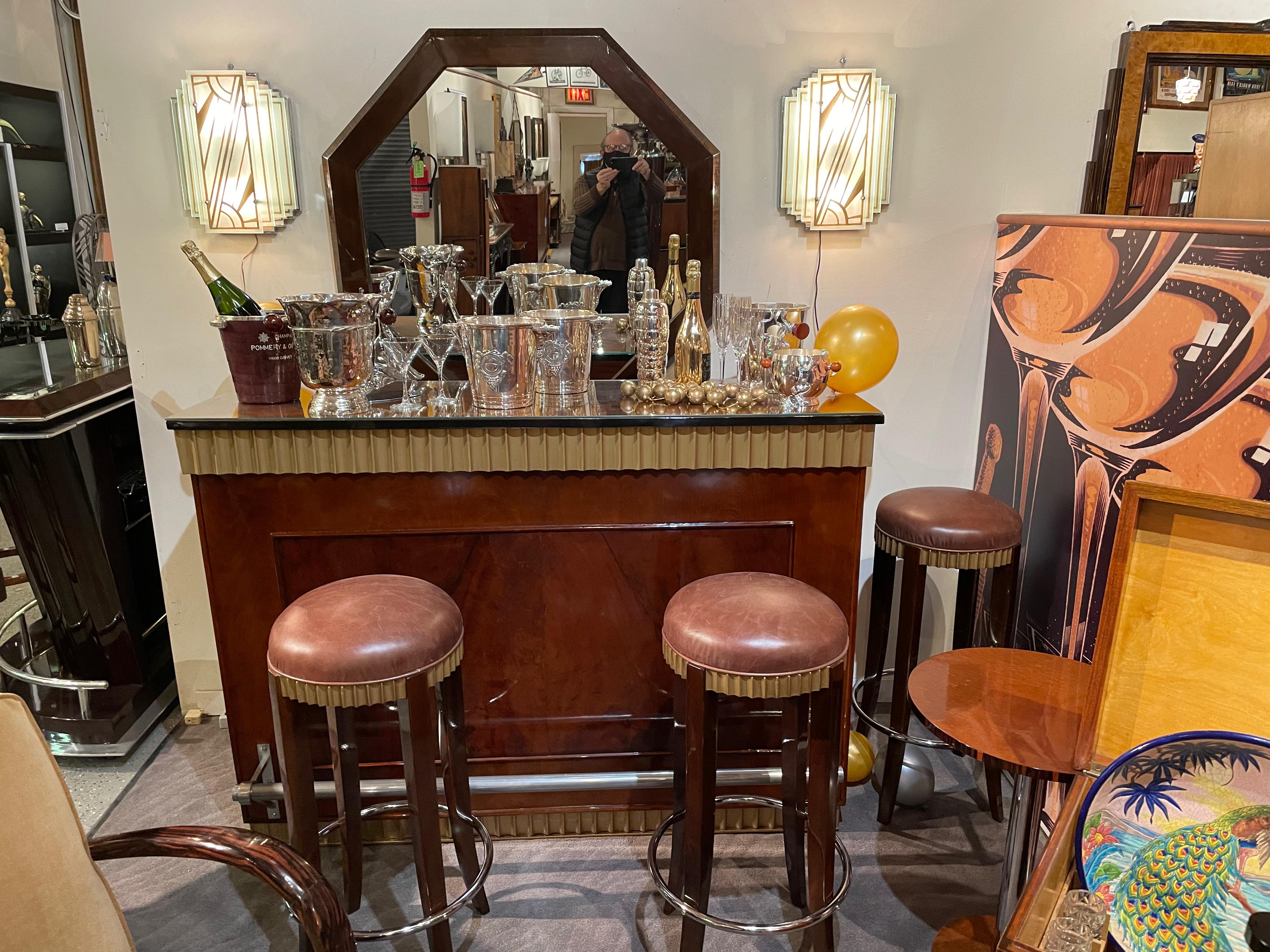 Art Deco fluted stand behind bar with 3 matching bar stools. Pristine condition. Excellent quality burl woods with gilding on all the fluted parts both top, bottom, and barstool seats, also with matching brown leather. Perfect chrome foot rail as a