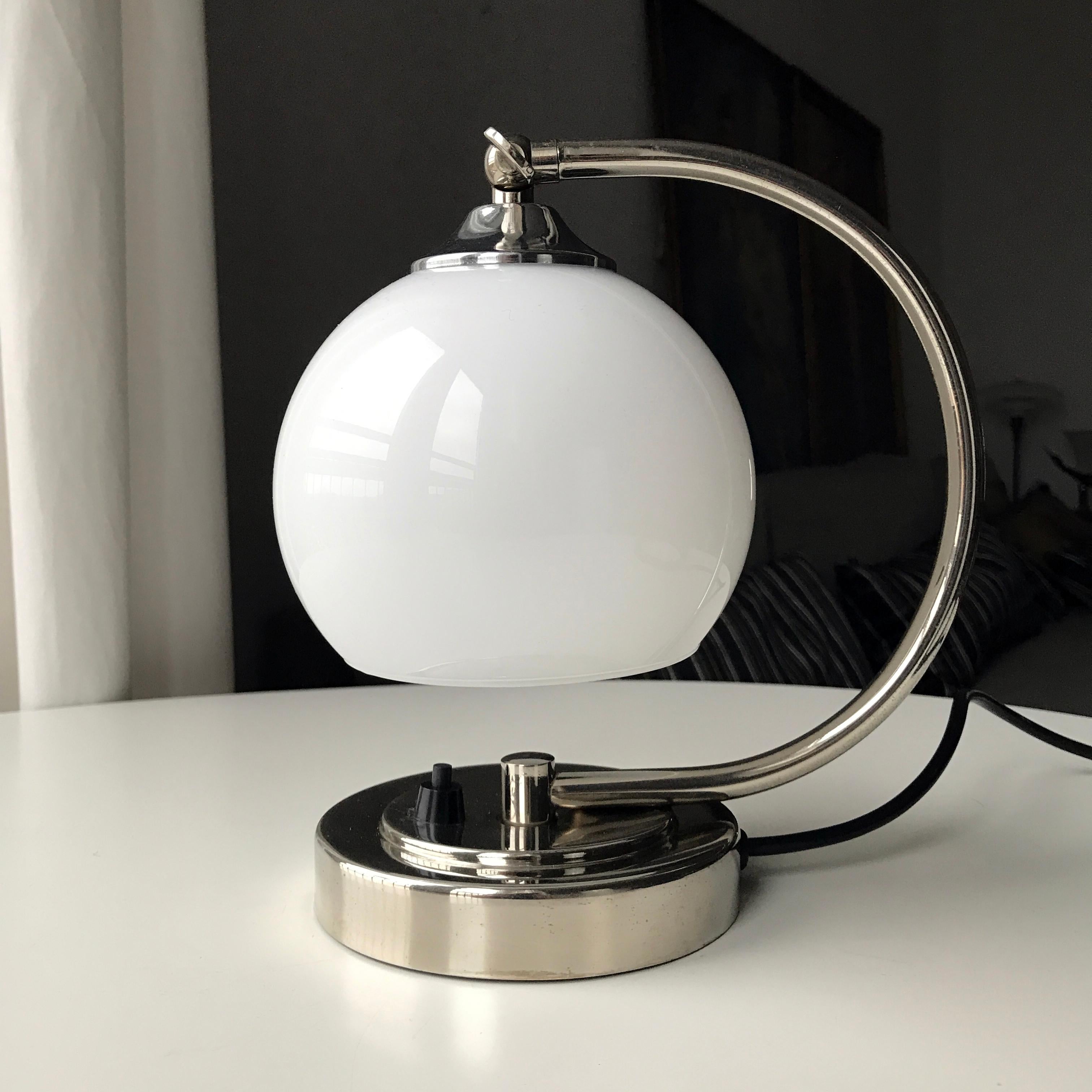 Art Deco Fog and Mørup Table Lamp with base in chrome metal and white opaline glass shade. Manufactured by Danish company Fog and Mørup in the period of 1920s-1950s. Angle of the glass holder can be adjusted within 90 degrees and locked in position.