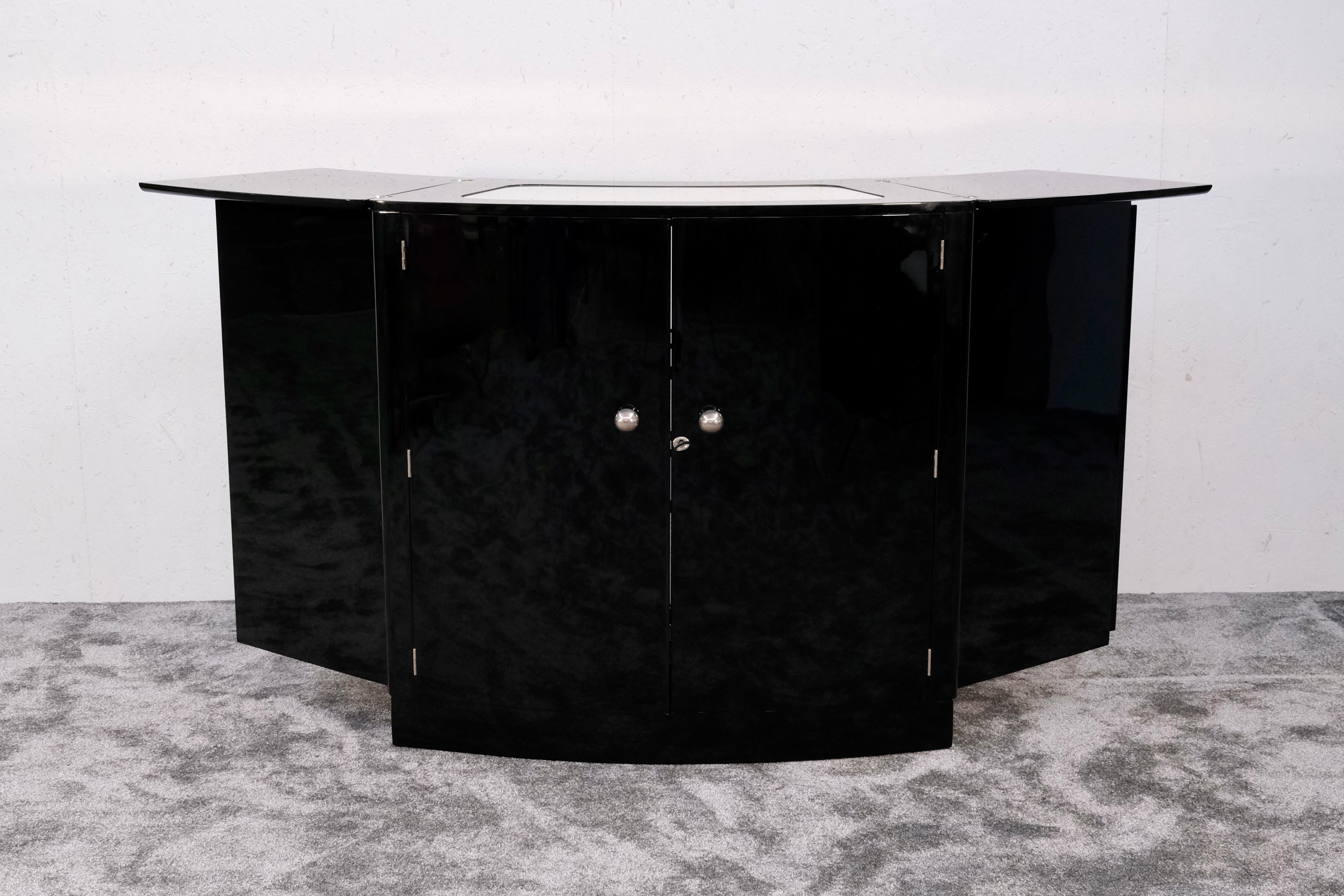 This French Art Deco Bar Cabinet from the 1930s is a stunning combination of functionality and timeless elegance. Designed as a Folding Bar Counter, it transforms effortlessly from a compact storage unit into a fully functional, semi-circular Bar