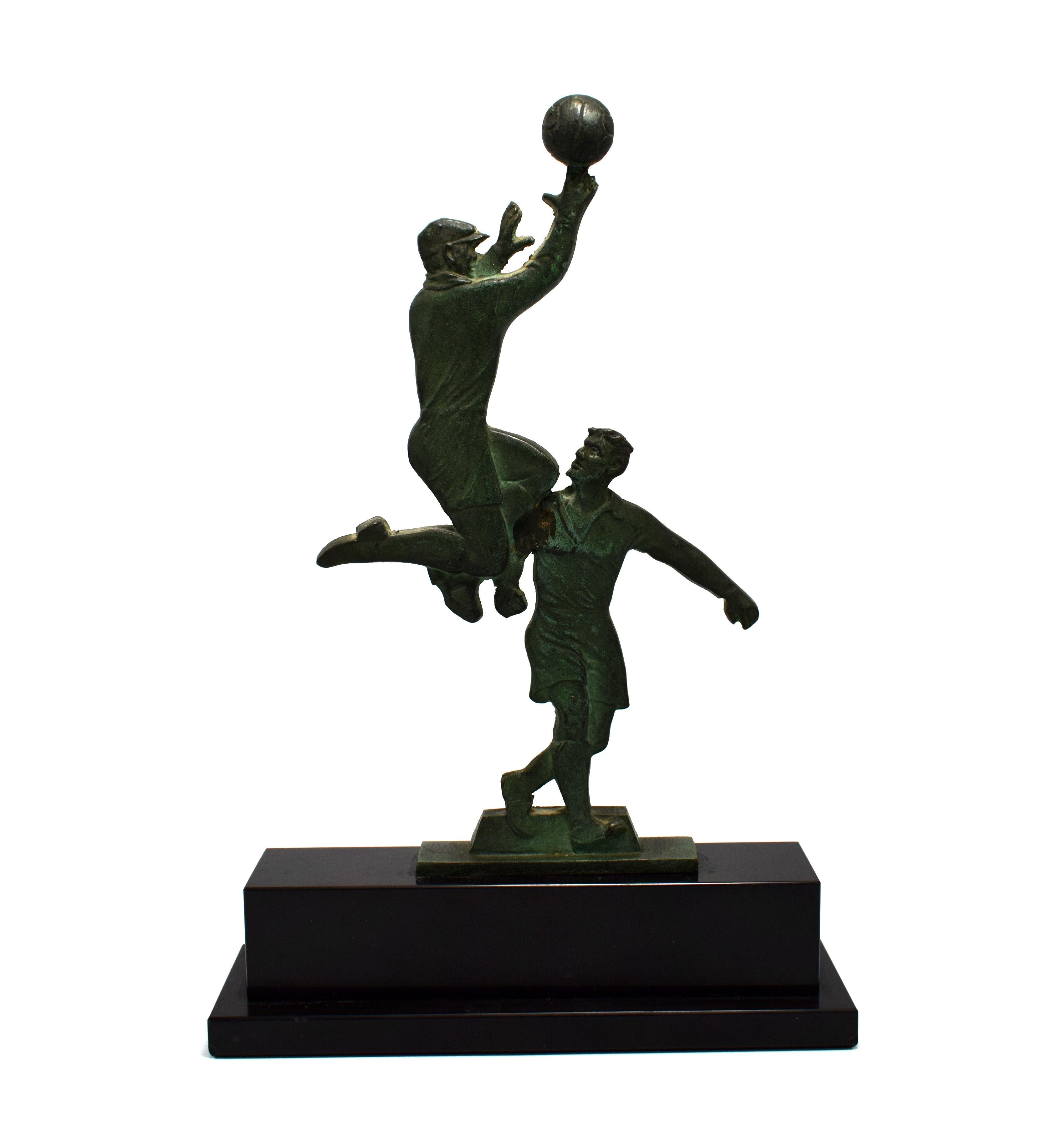 Orinating from France and dated to the 1930s is this fabulous figural group which depicts two footballers of the time mid play. You don't have to be a fan of sport or football for that matter to appreciate this piece. Historically very interesting,