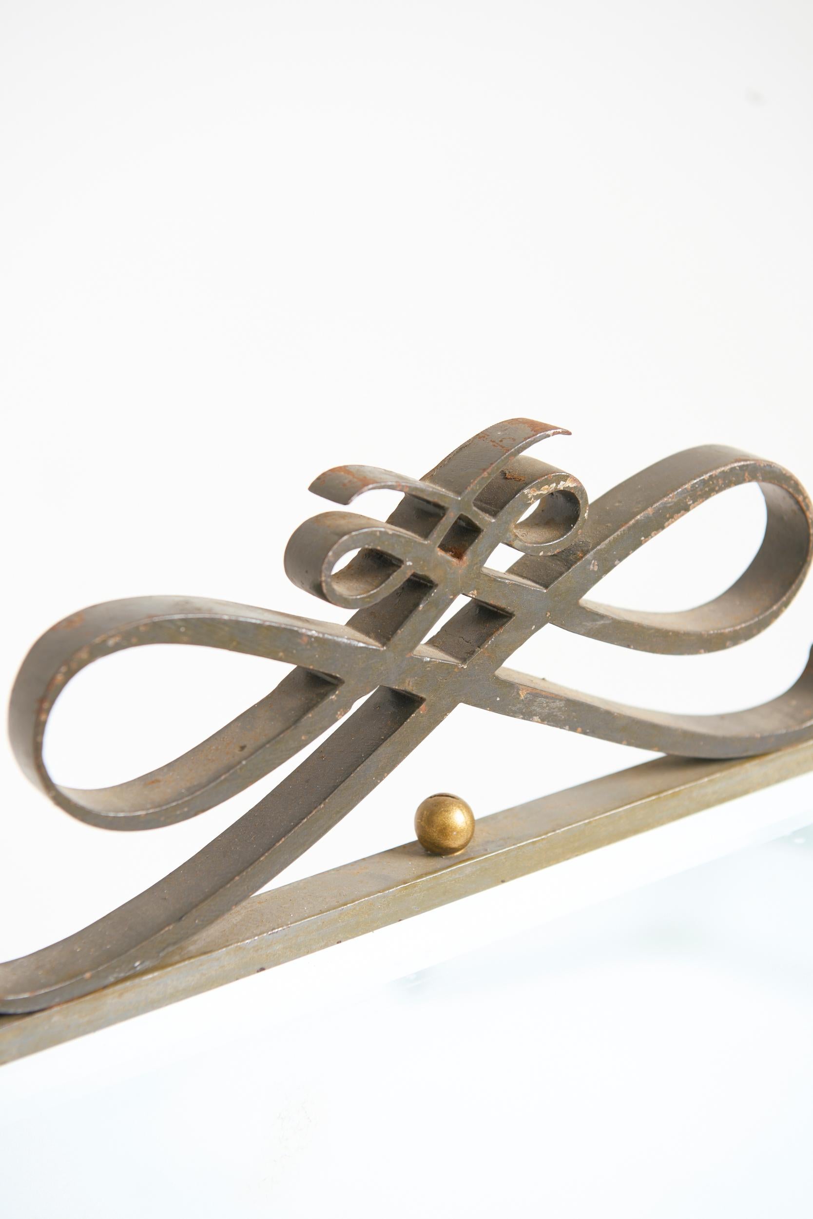 An Art Deco forged iron mirror, attributed to René Prou (1889-1947)
With its original bevelled mirror plate
France, Circa 1940
