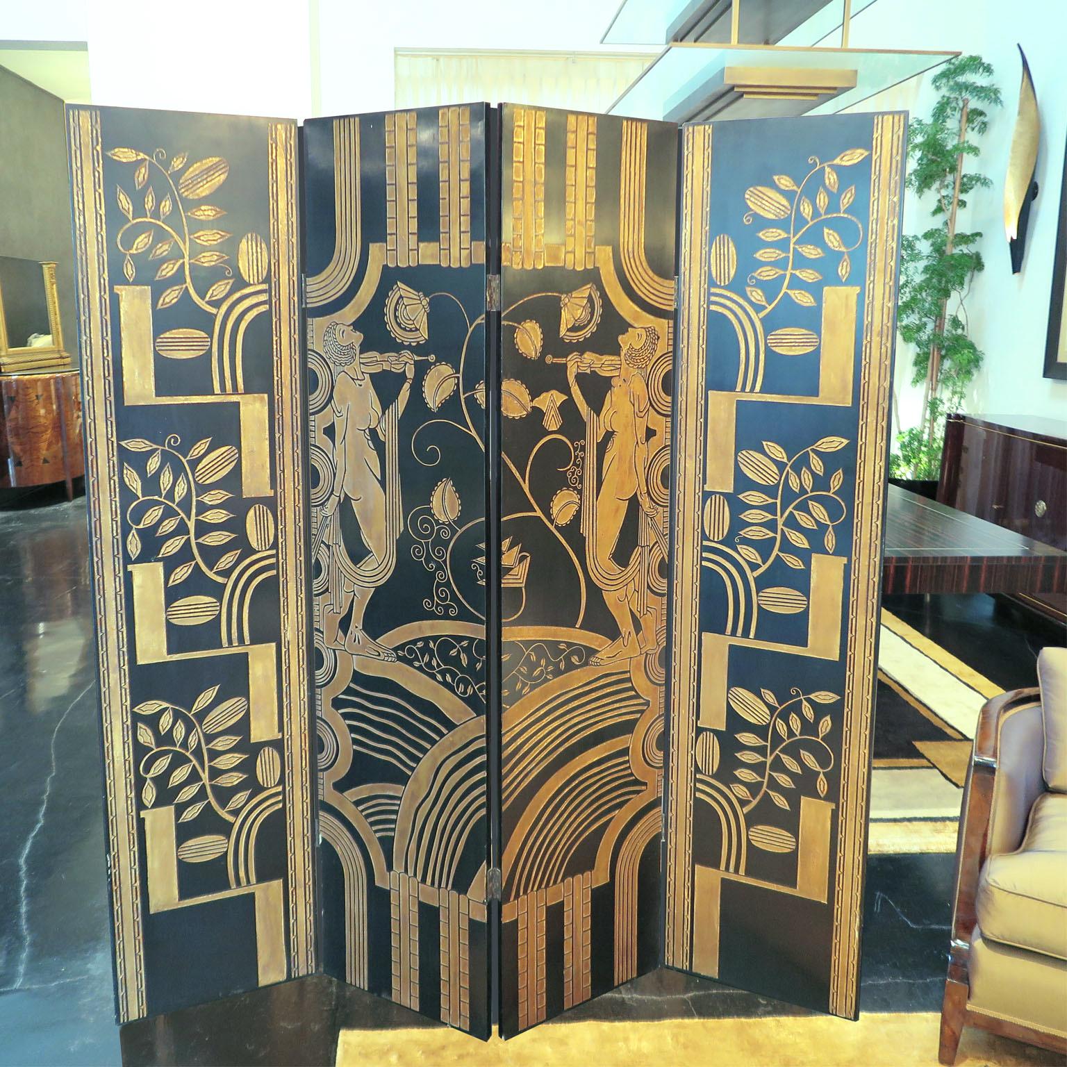 French Art Deco four panel screen. Matte black panels engraved with stylized nymph and nature motifs. Engravings in distressed gold leaf. Backside is matte black (no engravings). Original condition.
Hinges can also be removed and panels can be