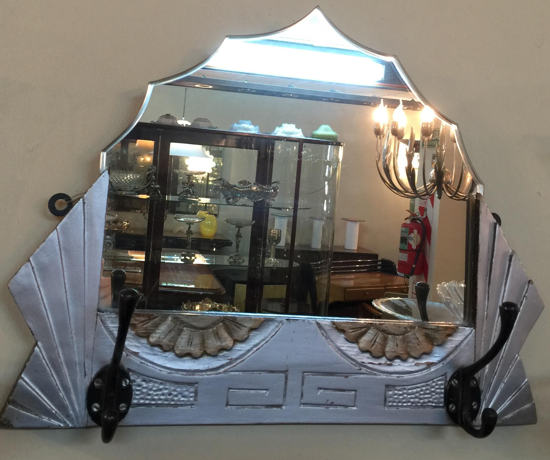 Amaizing mirror with coat rack.

Material: Wood and mirror
Style: Art Deco
Country: France
If you want to live in the golden years, this is the mirror that your project needs.
We have specialized in the sale of Art Deco and Art Nouveau and Vintage
