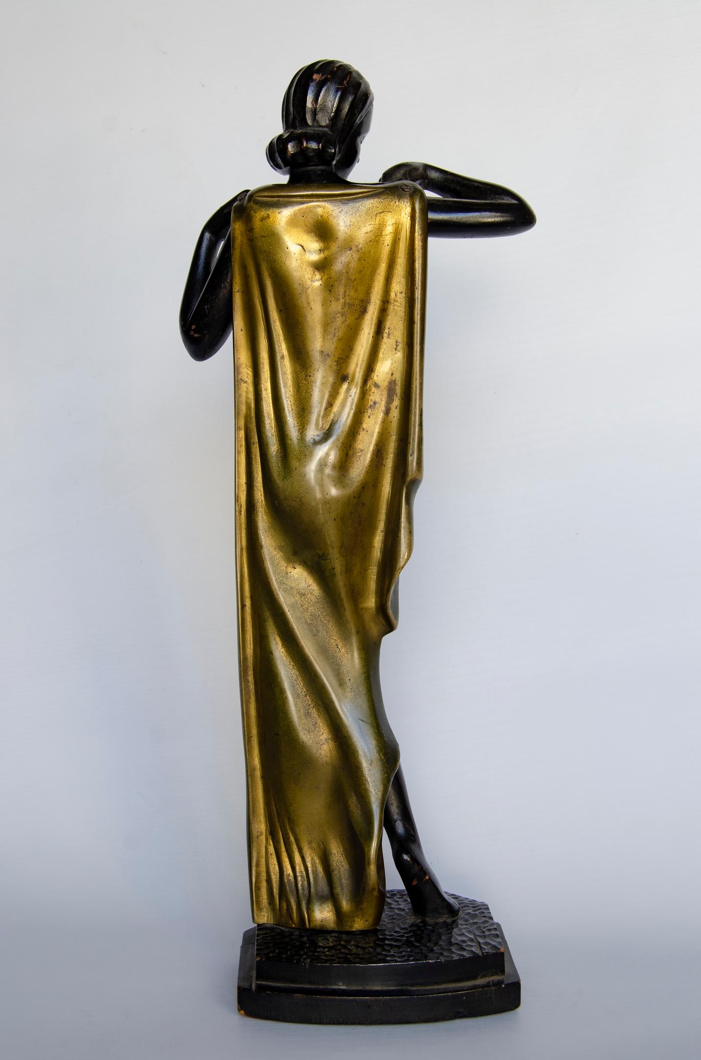 Art Deco France woman figure
wooden body and bronze mantle
without signature Origin France, circa 1930
some natural wear.