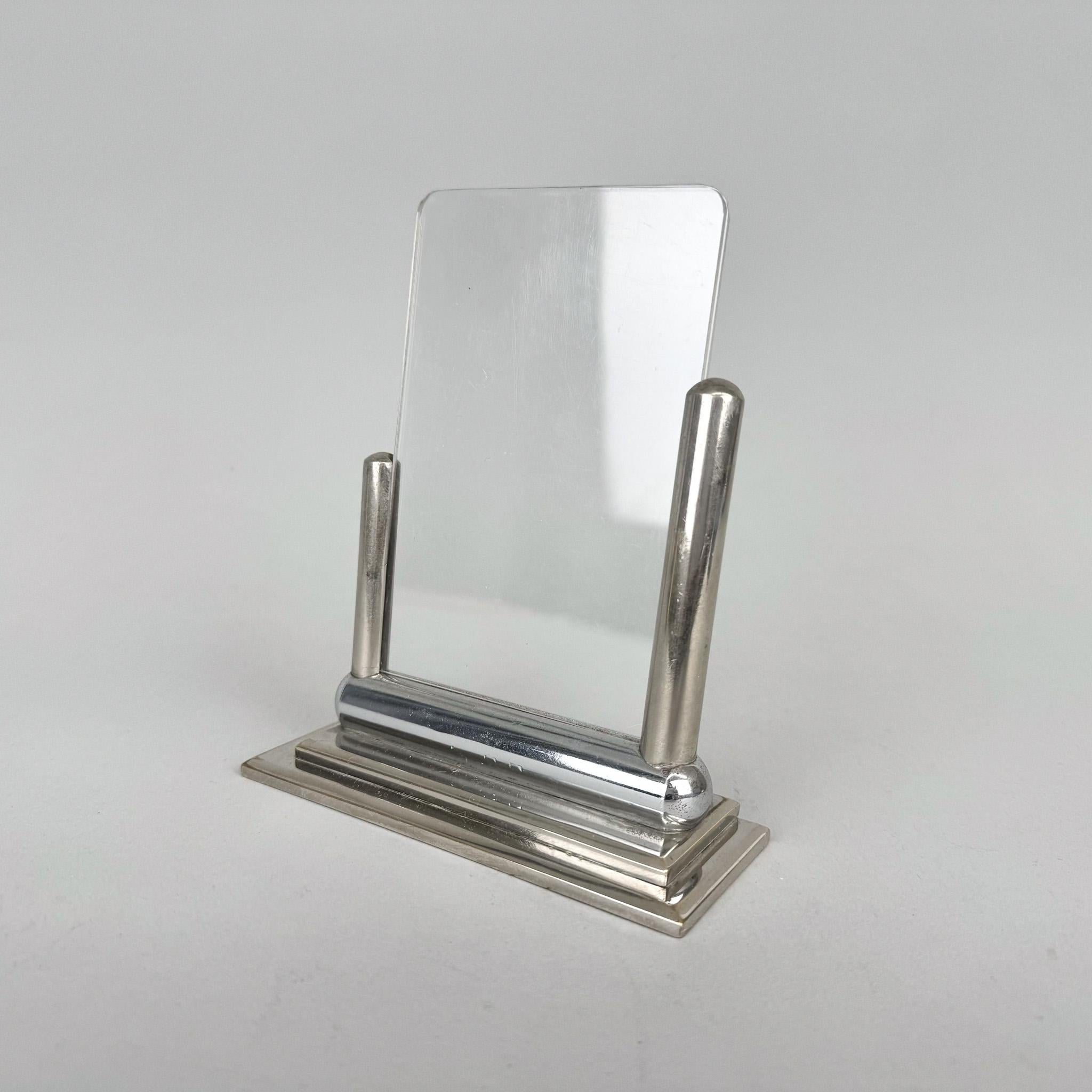 Chromed art deco standing photo frame made of chrome and two thin original plexiglass sheets.