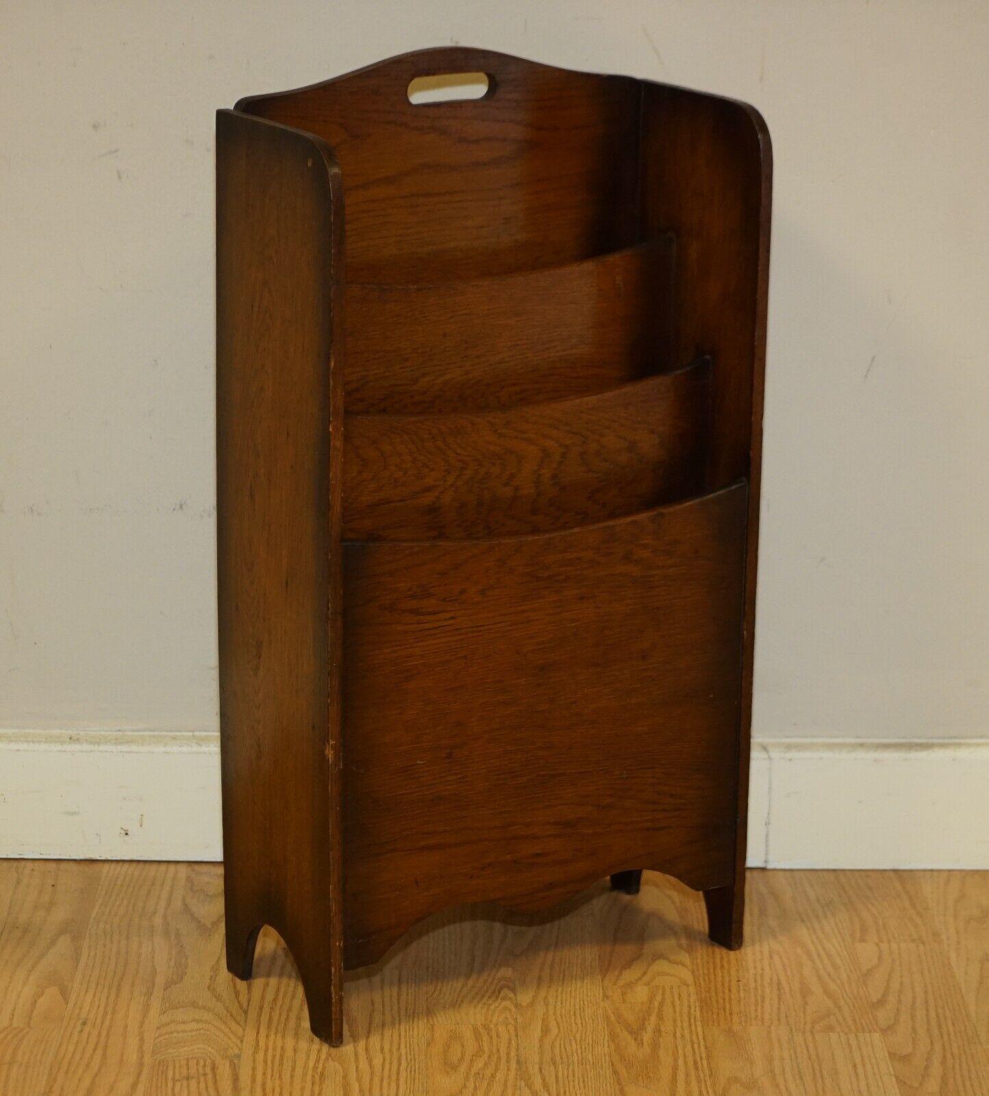 Here we have for sale this Art Deco free standing magazine newspaper rack, stand. This lovely looking stand has a rich patina and a few small signs of wear which are to be expected in original vintage pieces like this, it has been waxed and polished