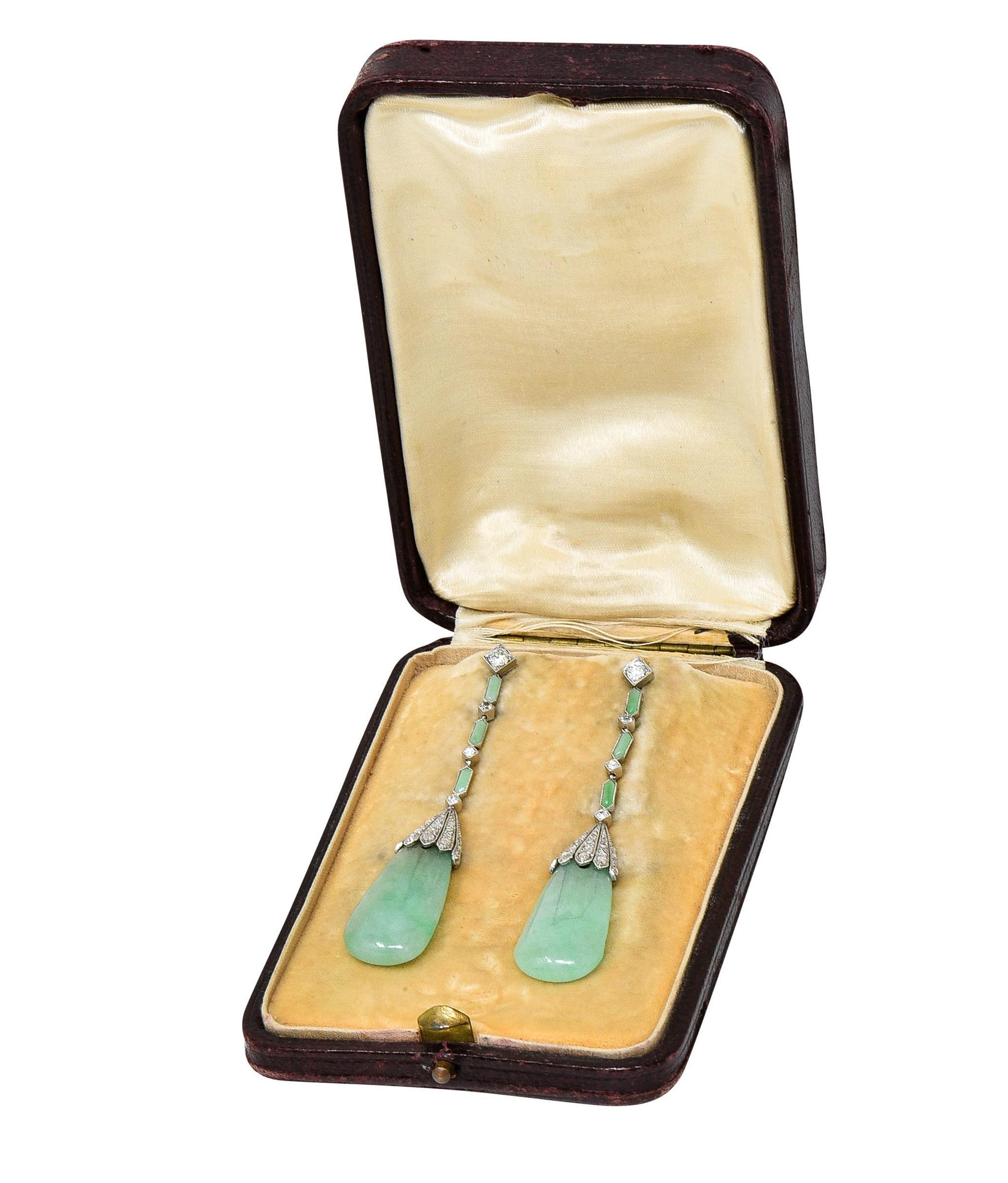 Designed as diamond-shaped surmounts and links featuring carved jade links and drops 
Links feature bezel set carved hexagonal-shaped jade plaques measuring 6.2 x 2.2 mm
Drops are wide teardrop shaped and measure 15.0 x 28.0 mm - drill set in