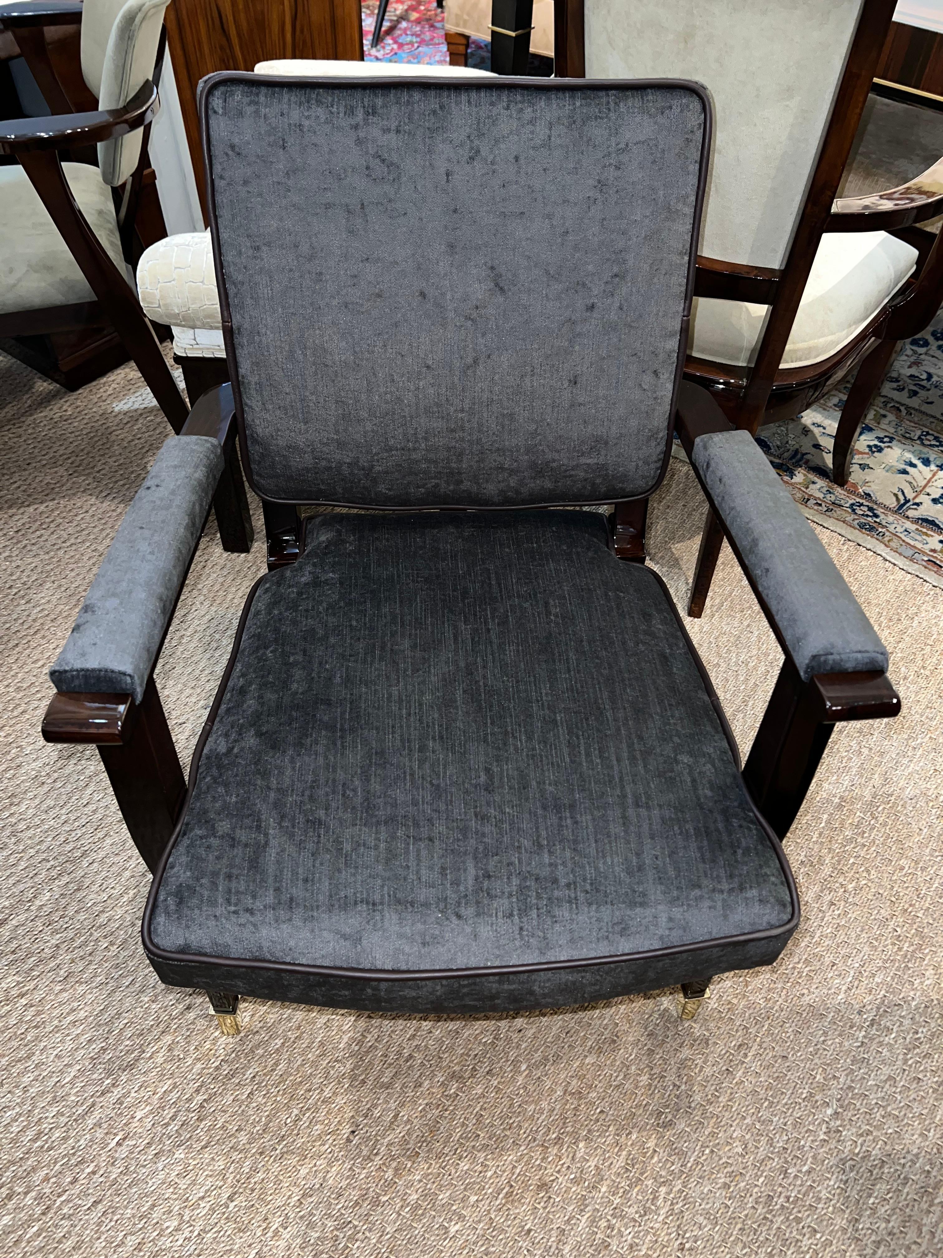 Comfortable desk chair is from Art deco period France. Newly re-upholstered in dark grey fabric and re-polished. Chair has leather piping on the edges of the chair. Two front legs tips are wrapped in brass tips. 

Condition is prefect. Restored
23
