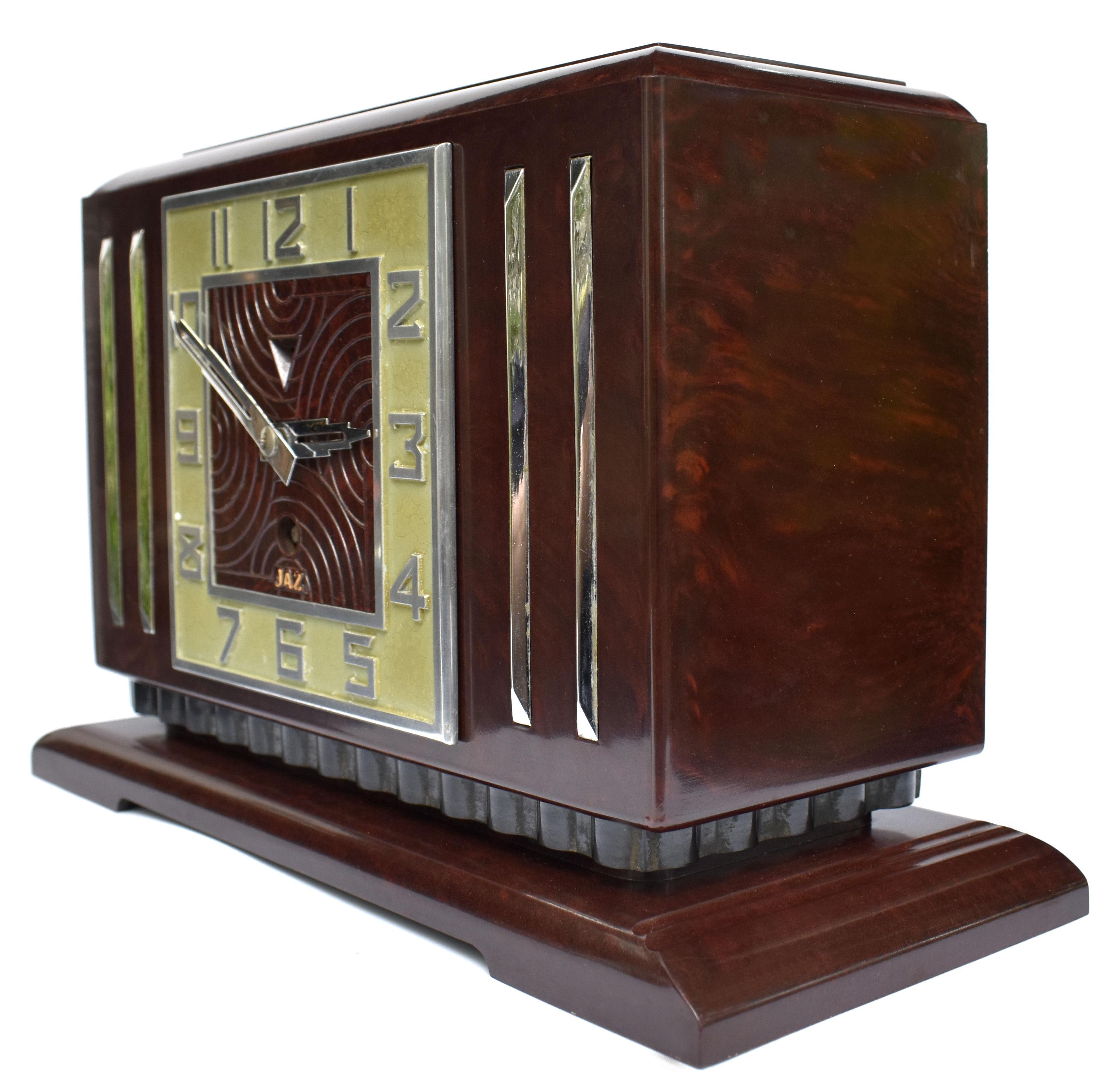 This is the daddy of true 1930's Art Deco clocks. Made in France by the very collectible Jaz company, this clock screams everything about the Deco era we all love and admire, streamline, industrial and modernist. The casing is a mottled deep red