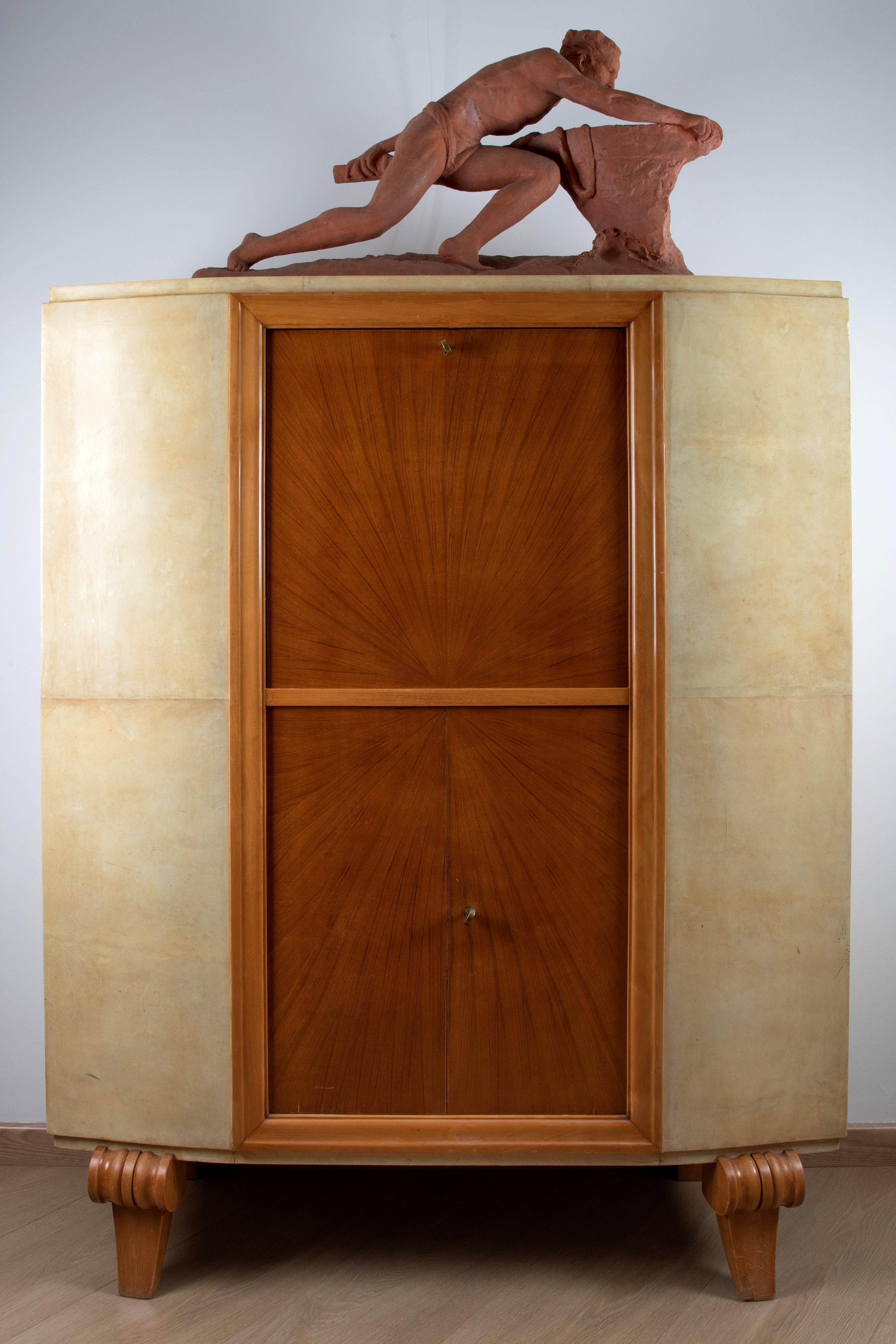 Art Deco bar cabinet French in wood and parchment with a mirror in the door, very elegant the double color light and dark .the door opens as a drop-leaf desk and offers a wide compartment for bottles and glasses. It offers multiple additional