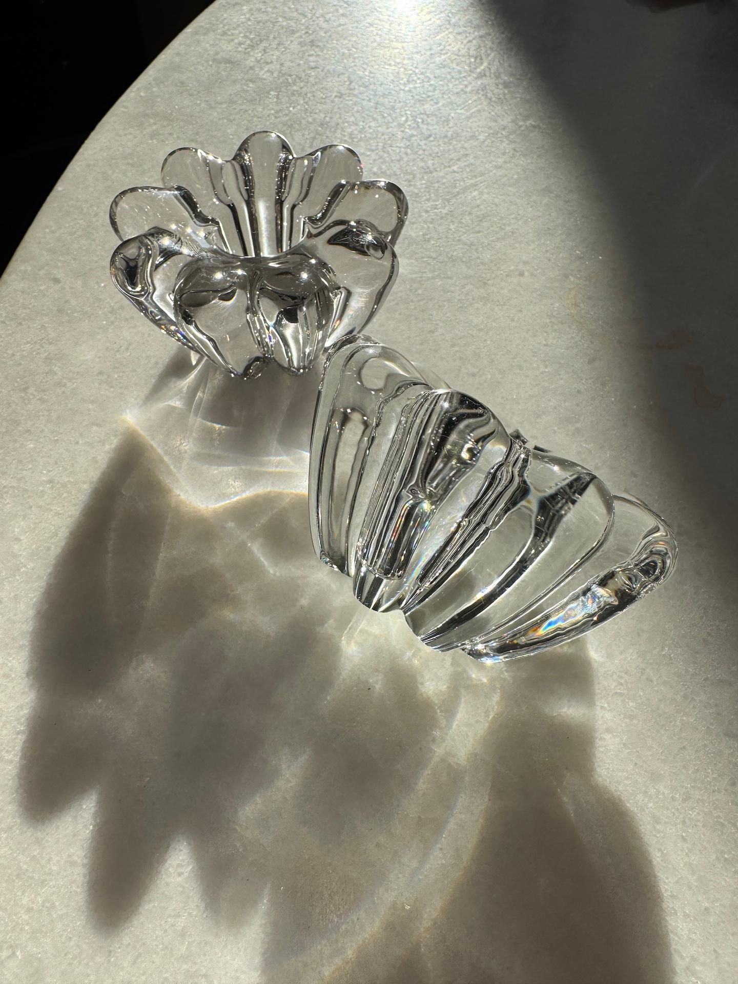 1920s pair of candle holders in clear transparent crystal. 

The Bayel Royal Manufacture was born in 1666, a hundred years before Baccarat, on the request of Louis XIV and Colbert. They produced for the French Royalty until 1727 and closer to our