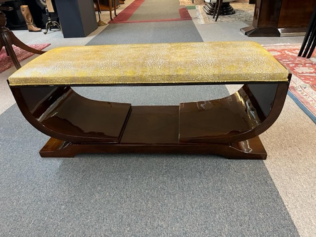 Bench is made out of walnut wood, comfortable seat is re-upholstered with gold/silver fabric. Bench is supported by two curved wooden legs that are connected with trapezoid shape base.

Condition is perfect, restored
France, c. 1930s
Measures: