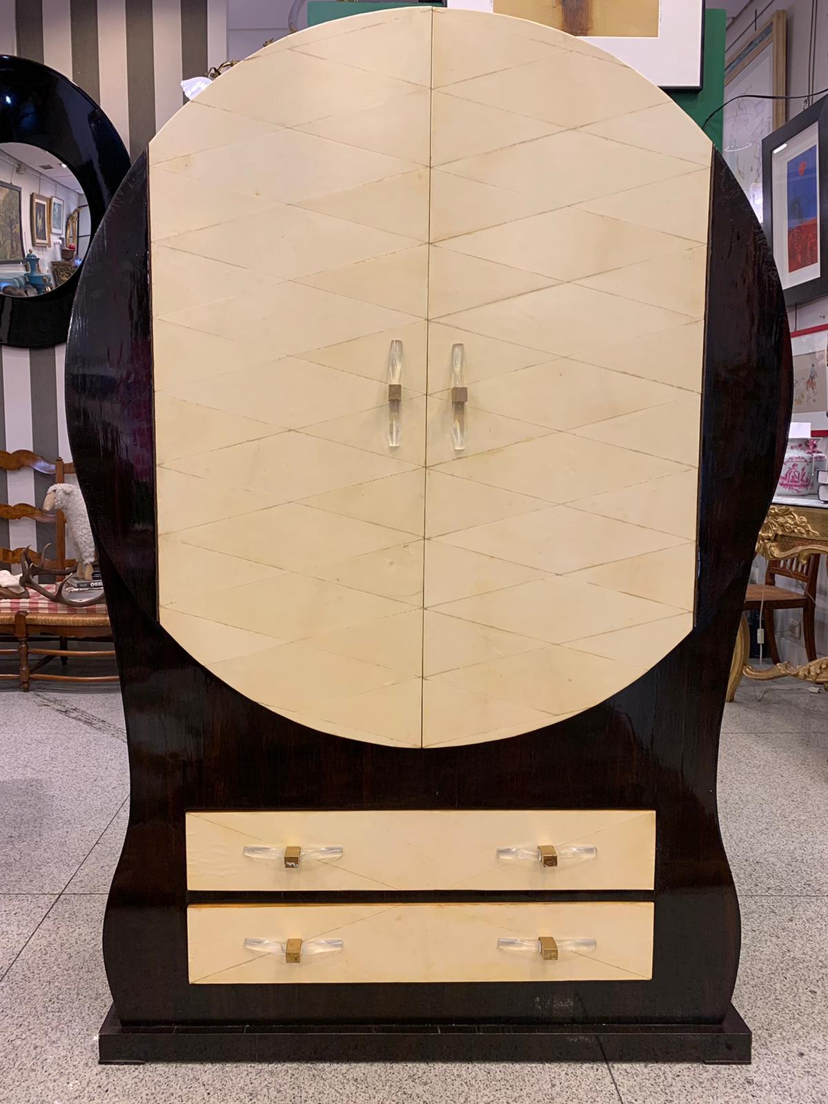 One of a kind and amazing French Cabinet Art dèco 40's - 50's following Jean Michel Frank, architect of a minimalism rich in noble materials. With a highly aesthetic and refined design, this cabinet is made of makassar wood and parchment or