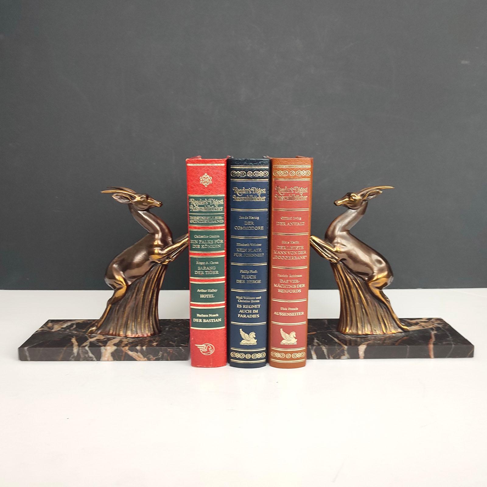 French Art Deco beautiful pair of book ends depicting two antelopes, in a jumping pose, sat on Portoro marble bases.
Highly detailed antelopes, made of spelter, finished in a bronzed - burnished copper patina.
Rich marble bases having a lovely