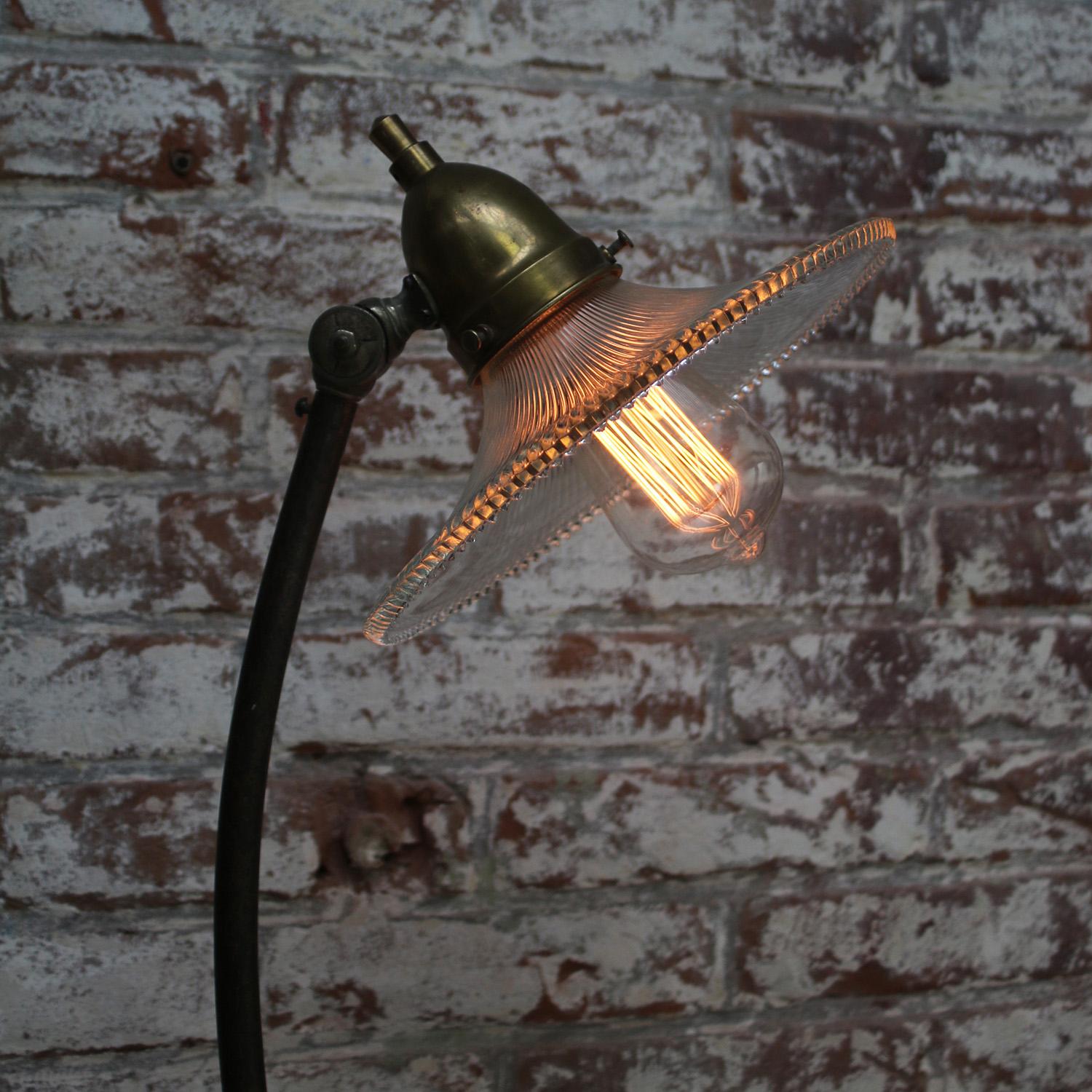 French Holophane glass, brass and cast iron desk light / table lamp
2,5 meter black cotton wire, plug and switch

Available with UK / US plug

Priced per individual item. All lamps have been made suitable by international standards for incandescent