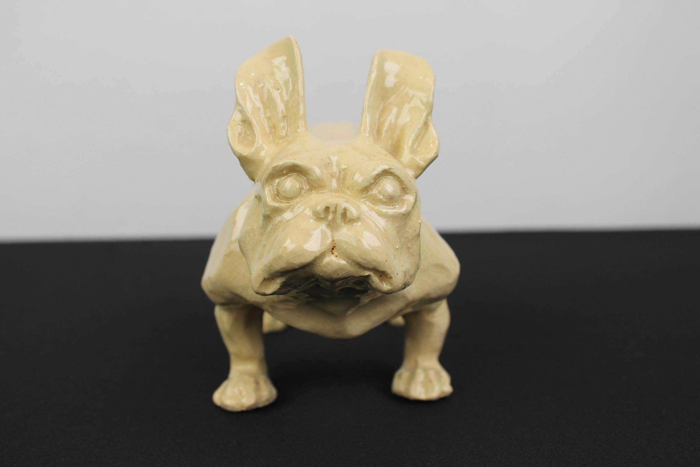 Art Deco French Bulldog Sculpture of ceramic.
This Frenchie sculpture is great by his design: a strong tough muscular impressive dog.
By age this bulldog sculpture does have craquelé, but that makes him charming. 

Bulldog - French Bulldog -