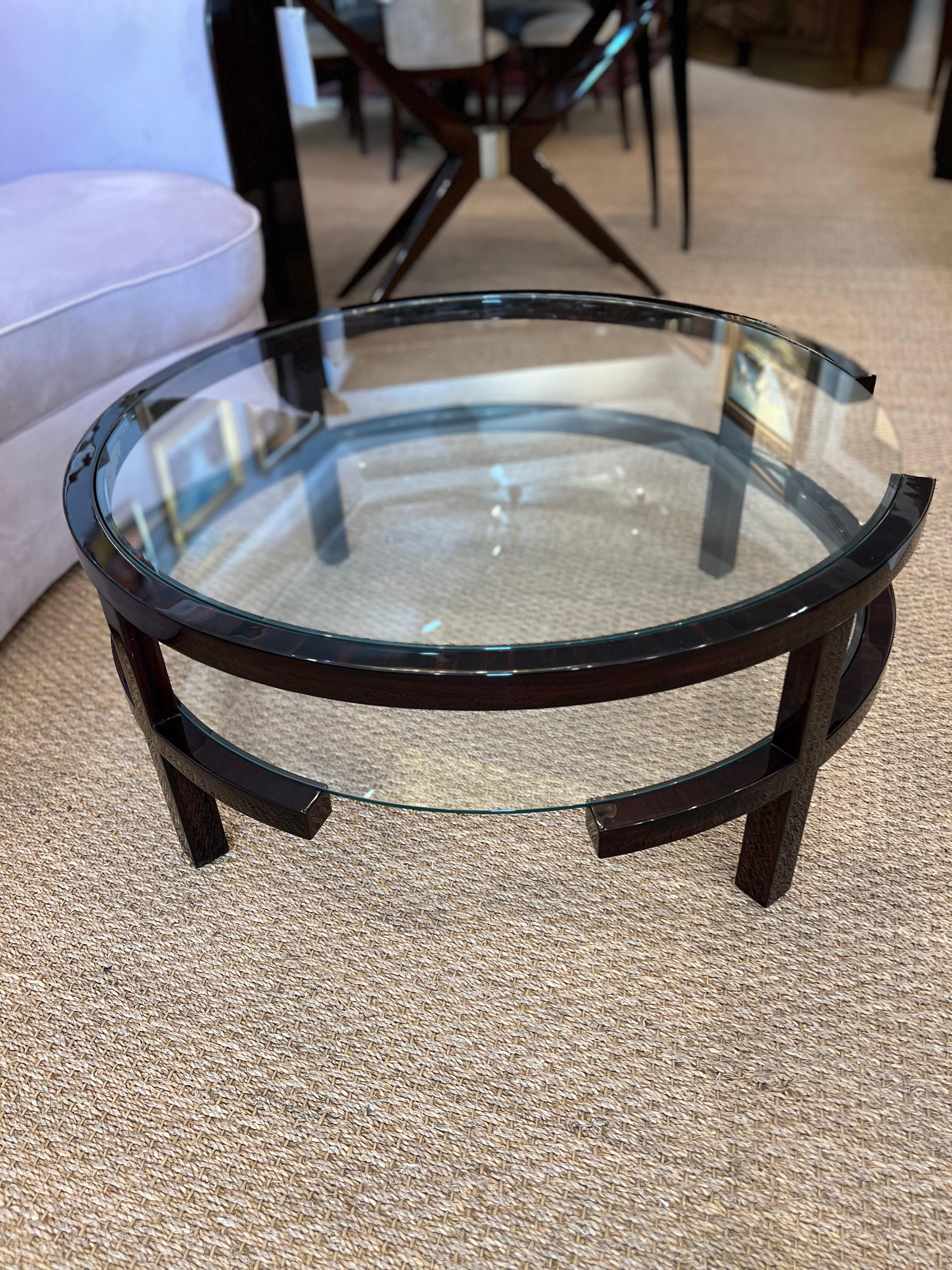 Art Deco French Coffee Table in Walnut

The coffee table is made out of walnut wood. The Glass table top is wrapped with a wooden support. Under the table top, there is a lower shelf made in the same style. 

Condition is very good, restored
France,