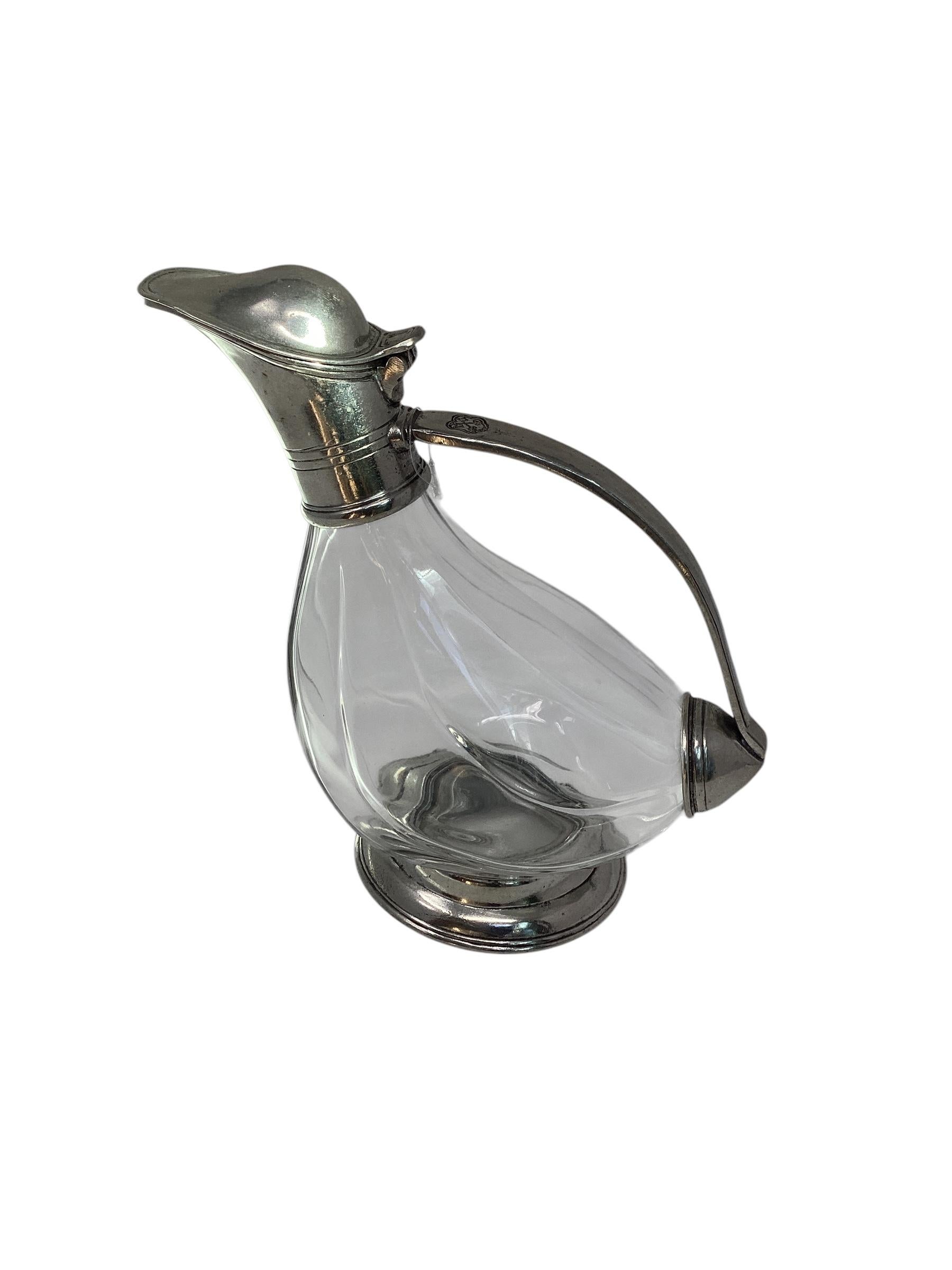 Very beautiful carafe, pitcher, jug, in crystal and pewter. Nice work of crystal and pewter. This carafe brings a touch of French elegance to the table decoration. Ideal for decanting and serving wine or liquor. The decanter is in the shape of a