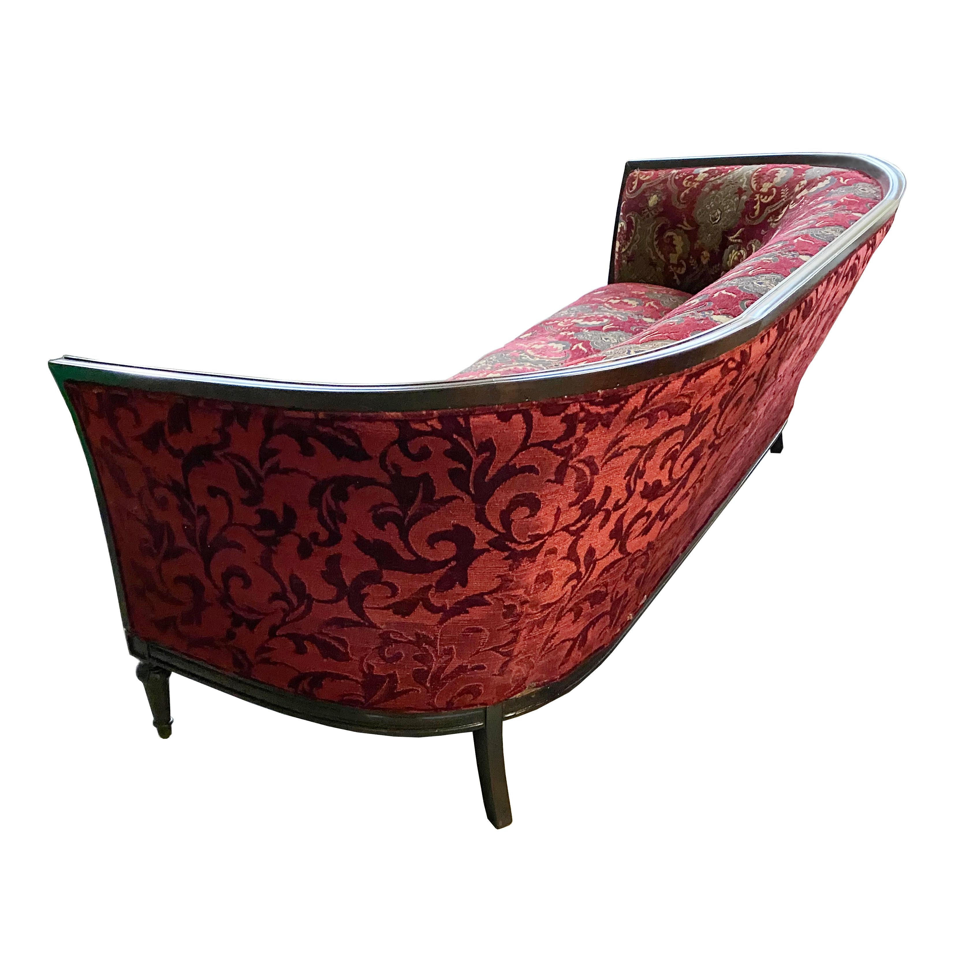 Art Deco French curved sofa

Mid 20th century, with rich jewel-toned damask coordinating with embossed upholstery on the back.
Ebonized mahogany frame. 


  