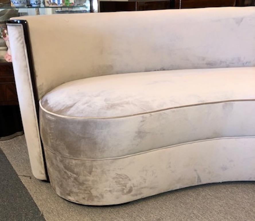 French Art Deco sofa

Great Art Deco sofa has “kidney” shape body. The back is slightly curved. Sofa is newly re-upholstered in a light beige velvet fabric. Outer edge of the back has dark walnut trimming, which creates strong juxtaposition of