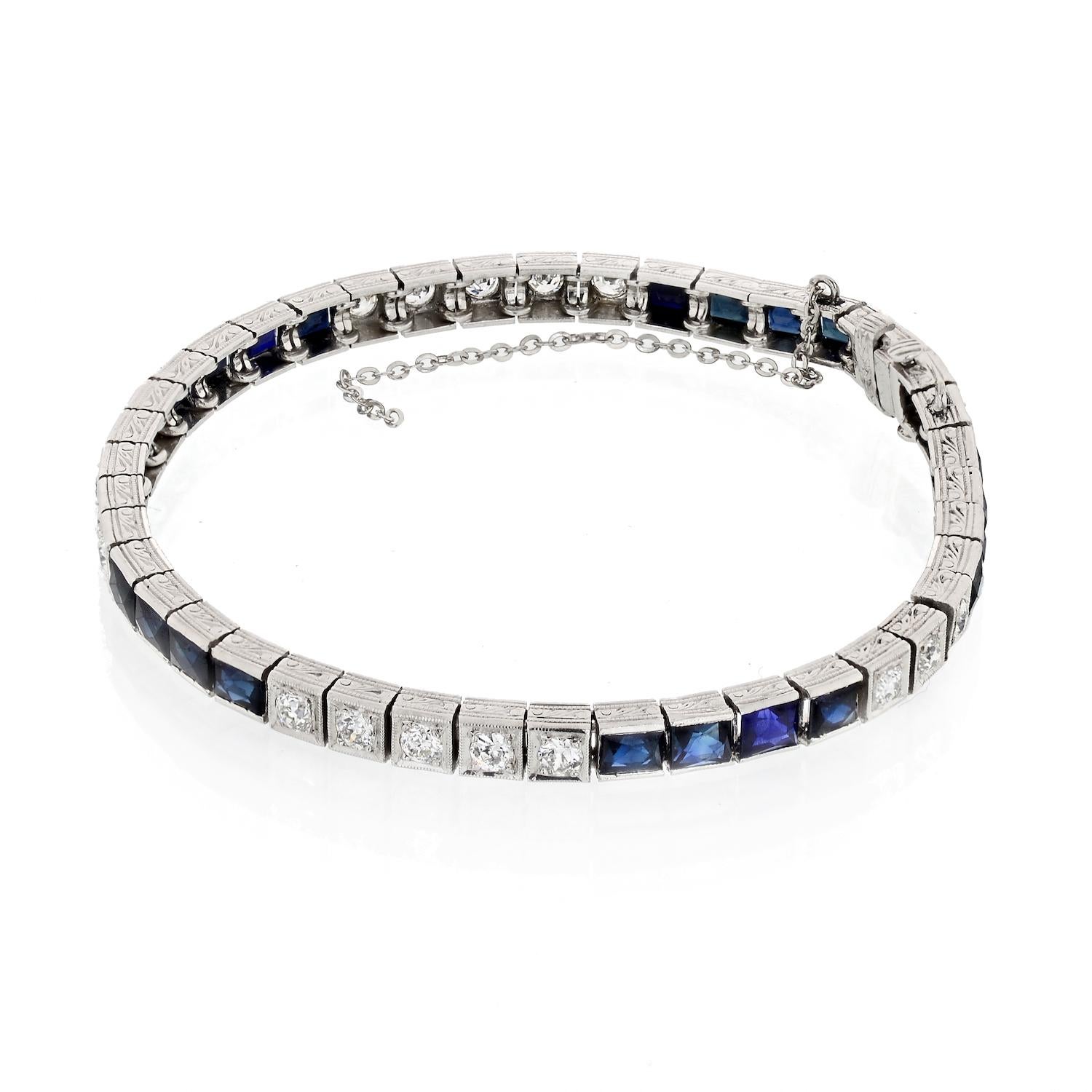 Beautiful Art Deco bracelet mounted with french cut blue sapphires and round cut diamonds. Lovely engraving is carved all throughout. Made in Platinum. 
Sapphire Weight: 2.50cttw (approx.)
Diamond Weight: 1.10cts (approx.)
Length: 7 inches 
Width: