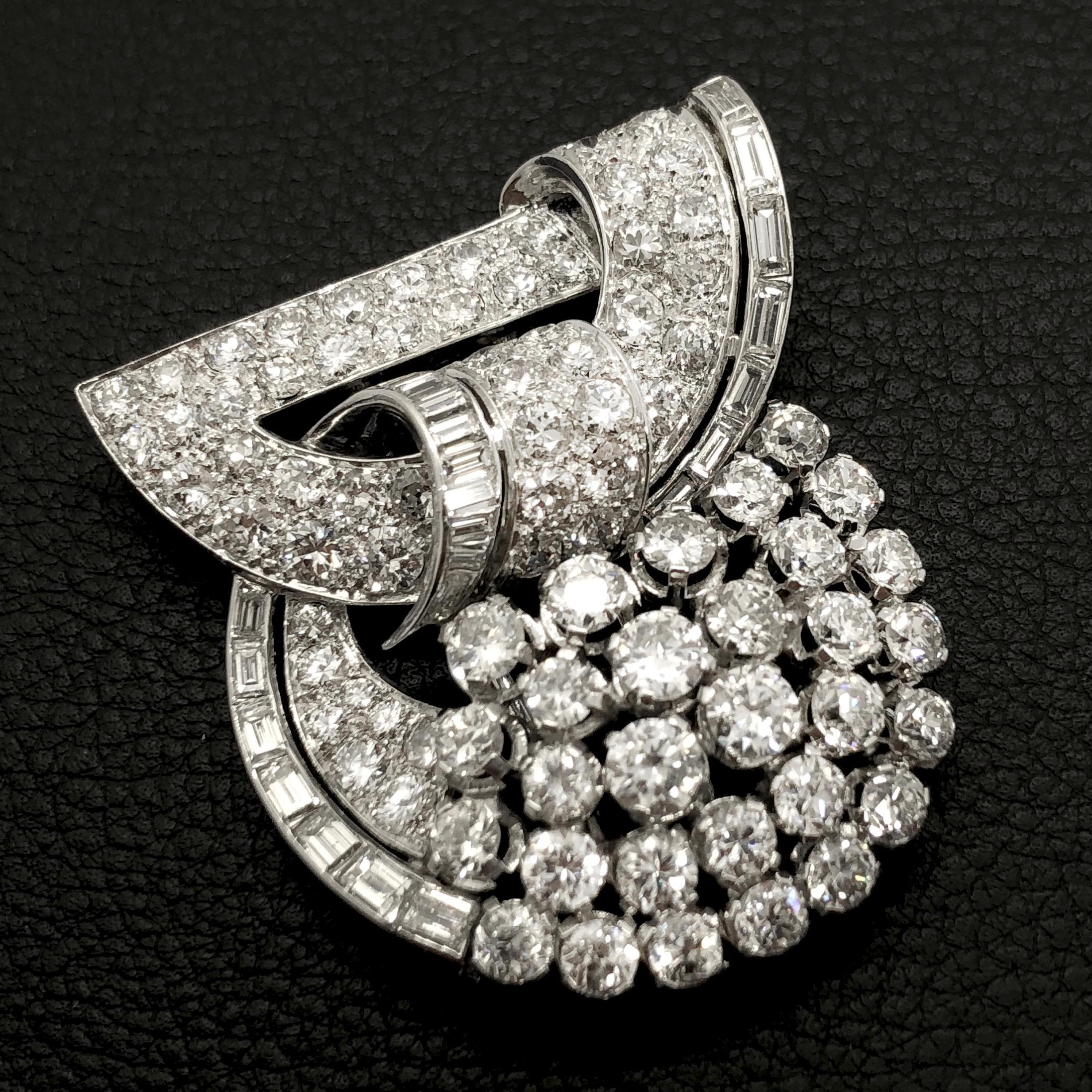 A beautiful large Art Deco Diamond Clip Brooch from the 1930s with old-cut and baguette-cut diamonds of ca. 11 carats. The brooch is made in platinum and has French hallmarks. There are later hoop fittings attached, which allow the piece to be worn