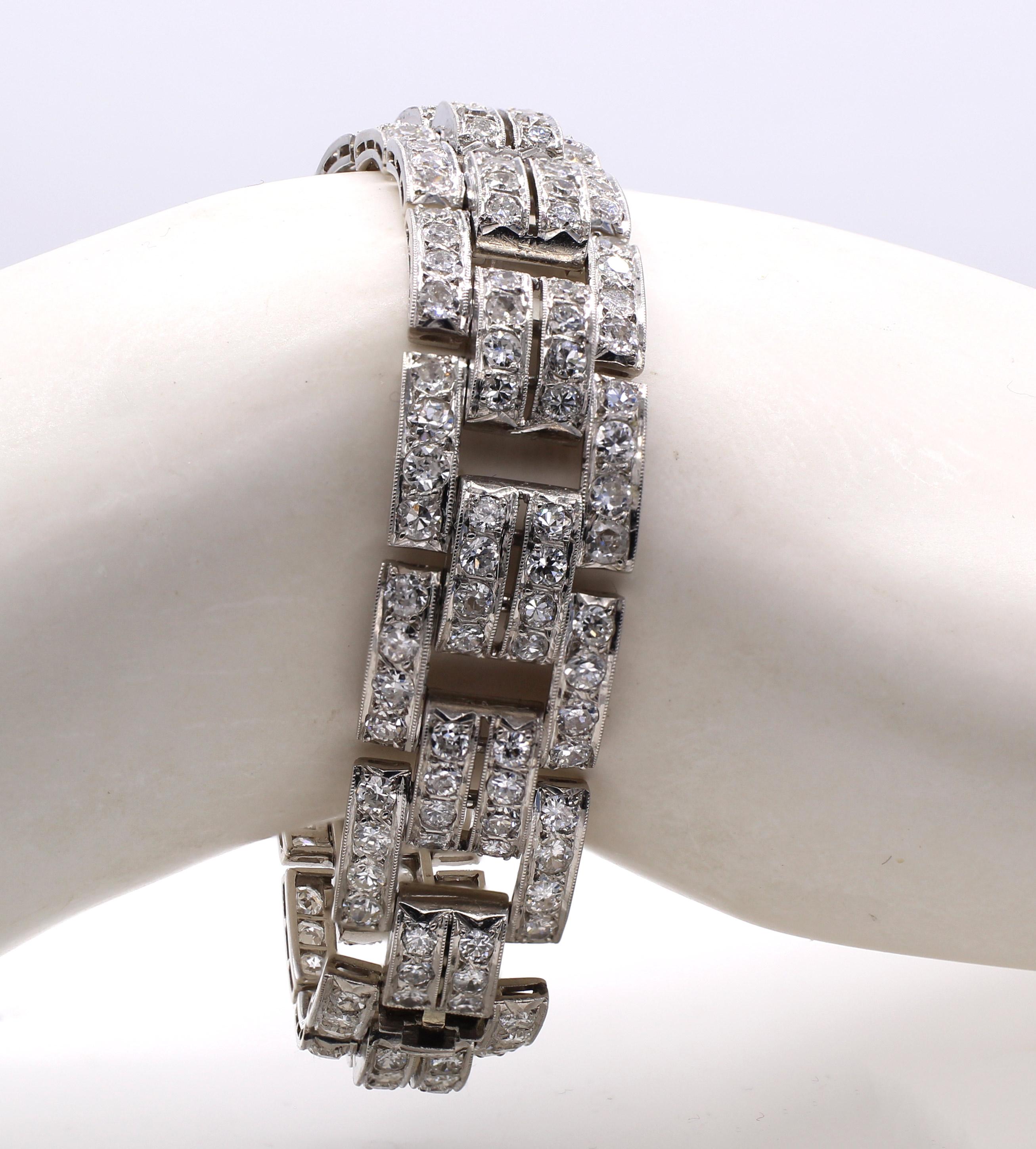 Masterfully handcrafted in France in ca 1930 this beautiful Art Deco bracelet is composed of 14 geometrical platinum elements flexibly connected by a pair of curved elements all set with perfectly matched bright white Old European cut diamonds. A