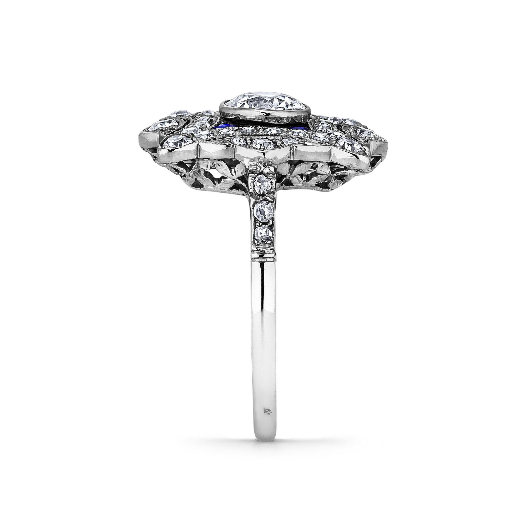 Wear it as an engagement ring, a pinkie ring, or an everyday accessory but always wear it with panache.  This French Art Deco, Circa 1930, diamond and sapphire platinum plaque ring can be worn as you see fit but will always be the statement piece in
