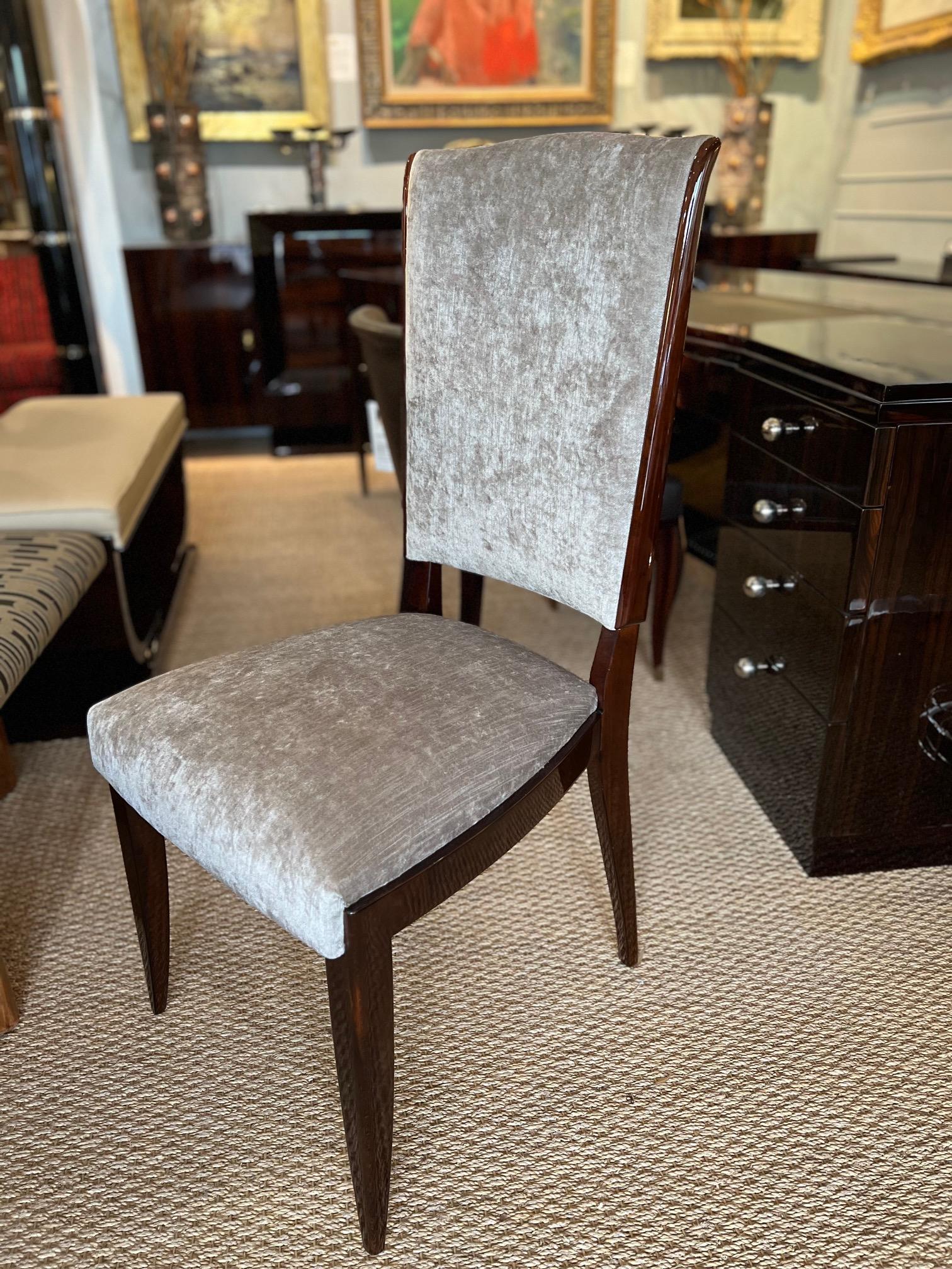 Beautiful Art Deco French 8 chairs made out of walnut wood and newly re-upholstered in light grey velvety fabric. Chair has high supporting back, resting on 4 slim but stable legs. 

Condition is great. Restored.
France. c. 1930s
19