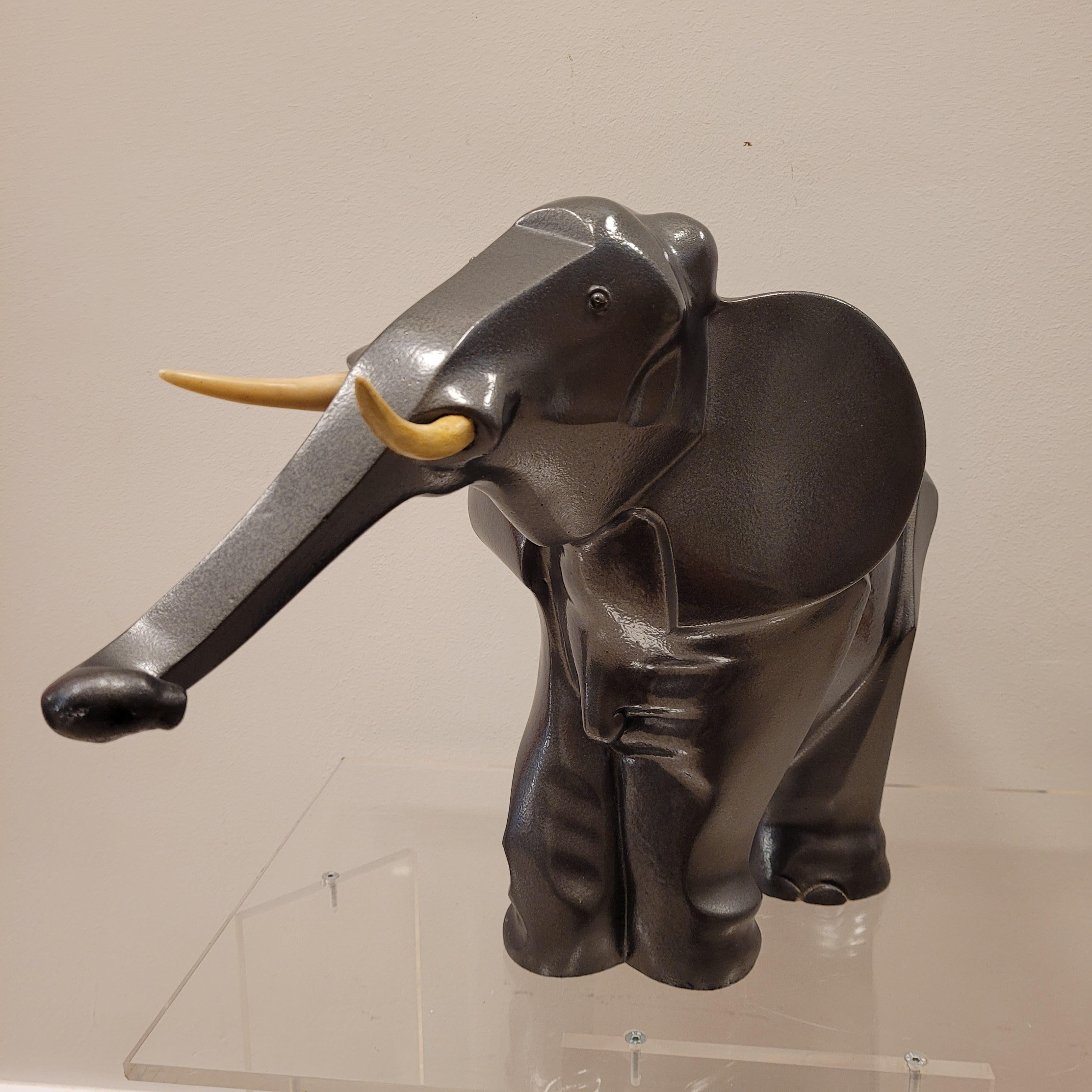 Gorgeous Art Deco elephant made of babbitt, original metal used at the time, beginning of the 20th century, following the style of Irénée Rochard (1906 - 1984). With round and faceted shapes, this sculpture is born from the polygonal approaches of