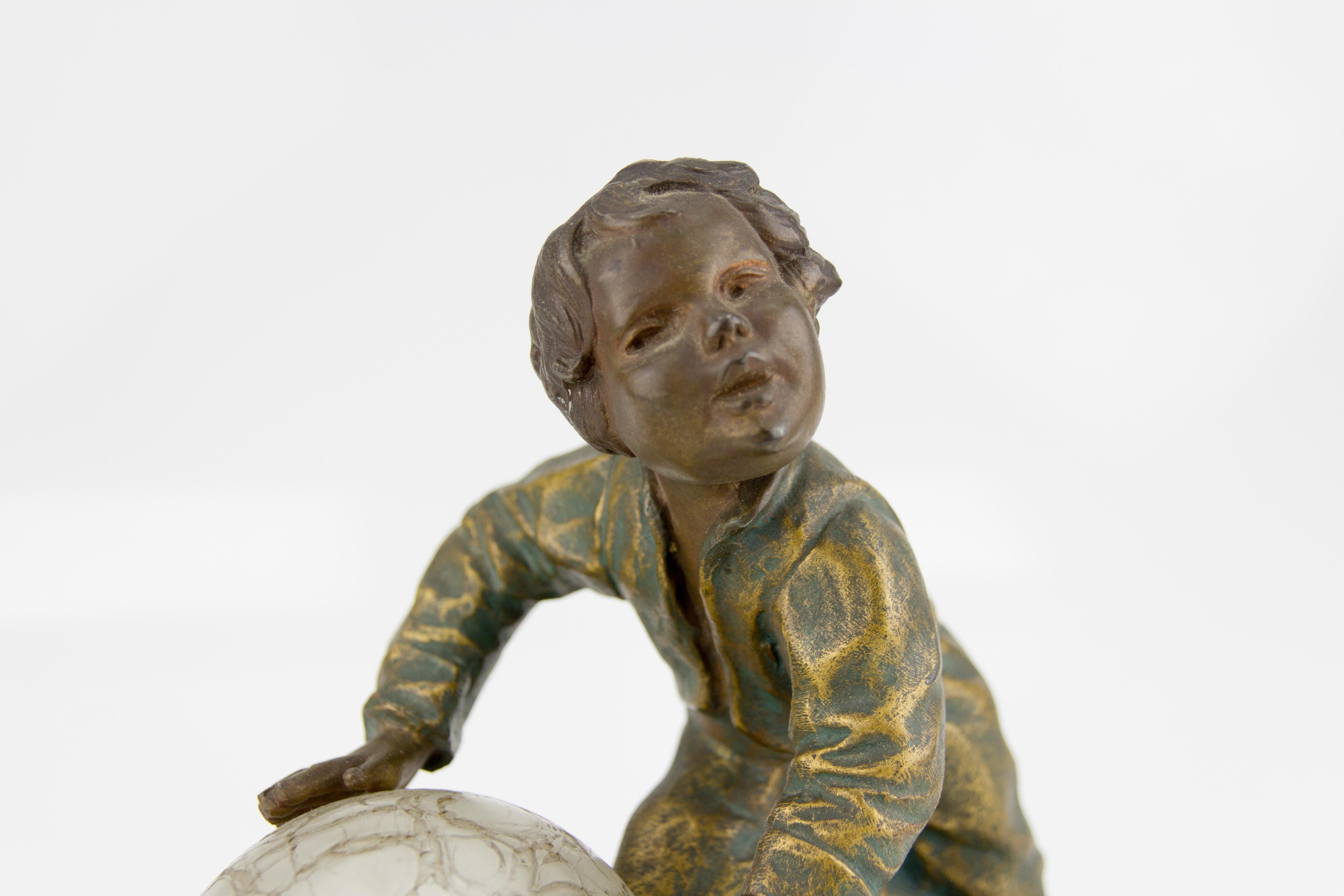 Bronzed Art Deco French Figural Lamp Boy Pushing a Snowball Crackle Glass Globe Shade