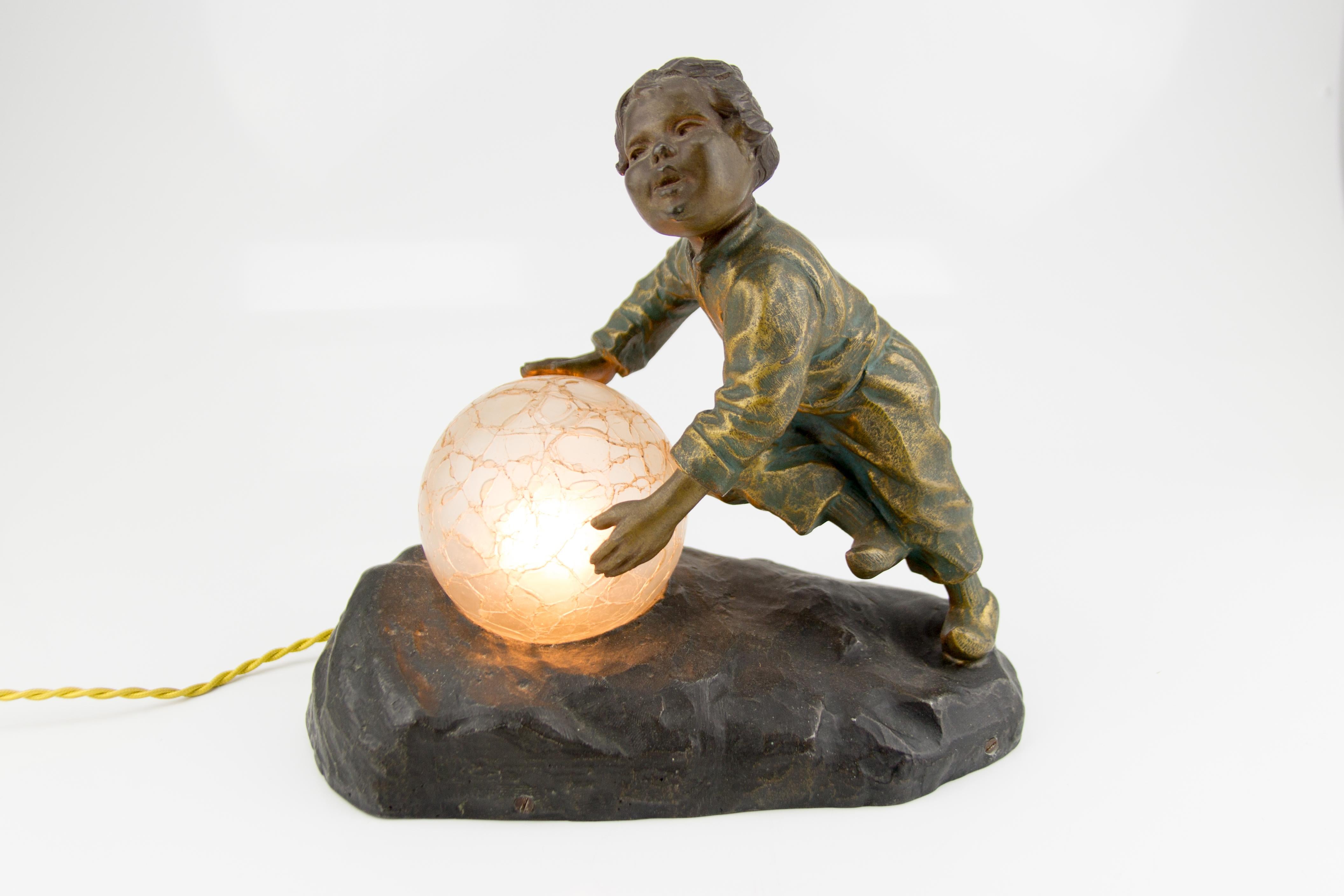 Art Deco French Figural Lamp Boy Pushing a Snowball Crackle Glass Globe Shade In Good Condition In Barntrup, DE