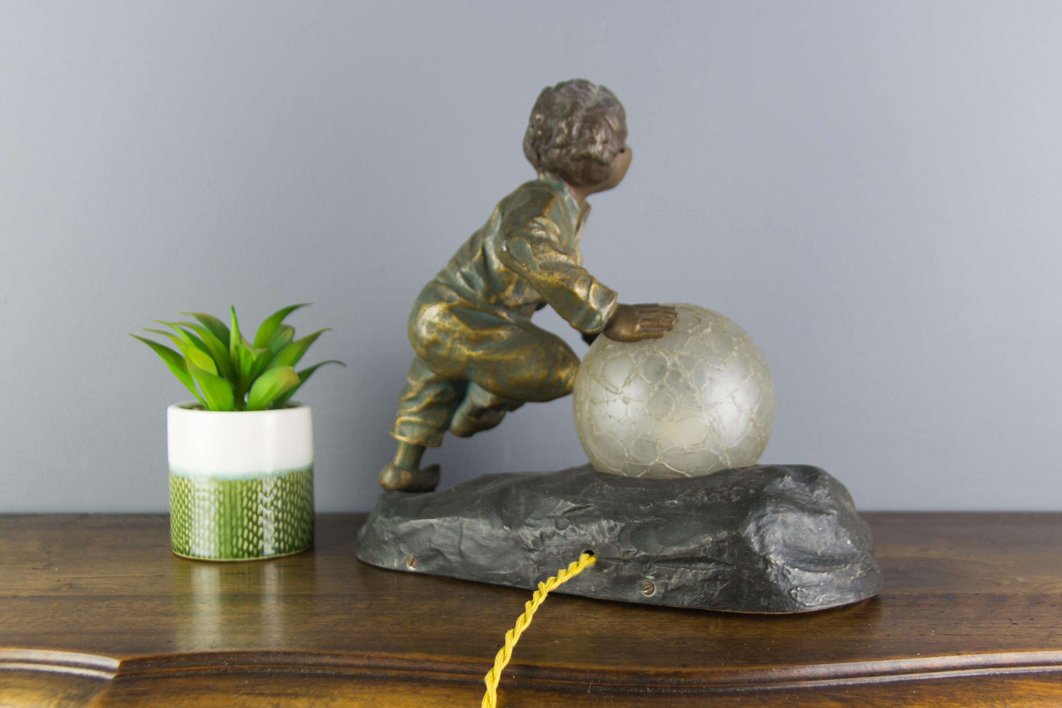 Art Deco French Figural Lamp Boy Pushing a Snowball Crackle Glass Globe Shade 4