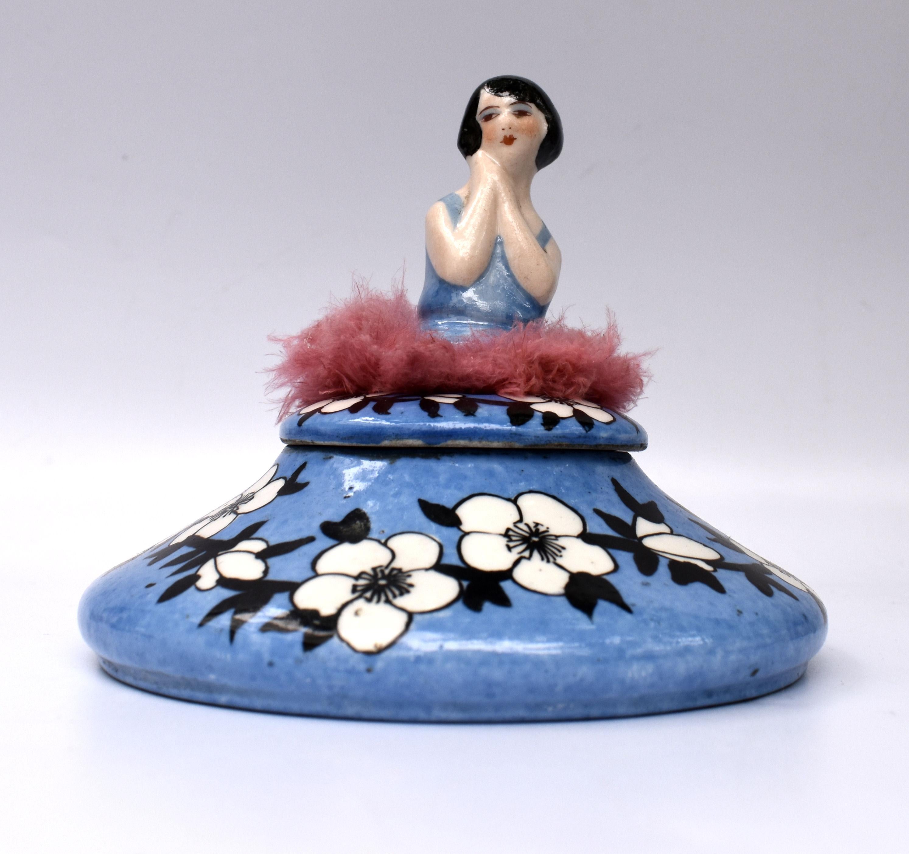 Art Deco 1930's ceramic powder bowl, signed underneath 'France'. Features a flapper girl vibrantly coloured with her black bob haircut. Made in France. A rare design and very high quality that we have come to expect from French ceramics. Fine and