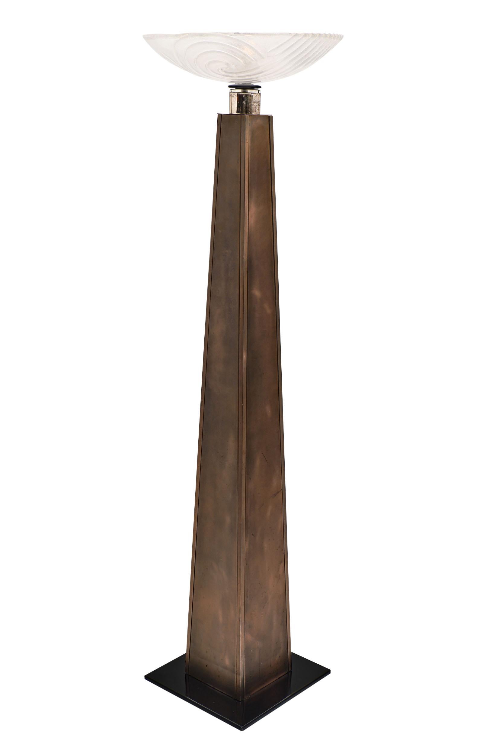 French Art Deco floor lamp in the style of Jean Dunand and made of copper. A beautiful Murano glass bowl sits atop the structure. This hand blown glass has a textured interior and a swirl pattern. Two candelabra base light bulbs. Black lacquered