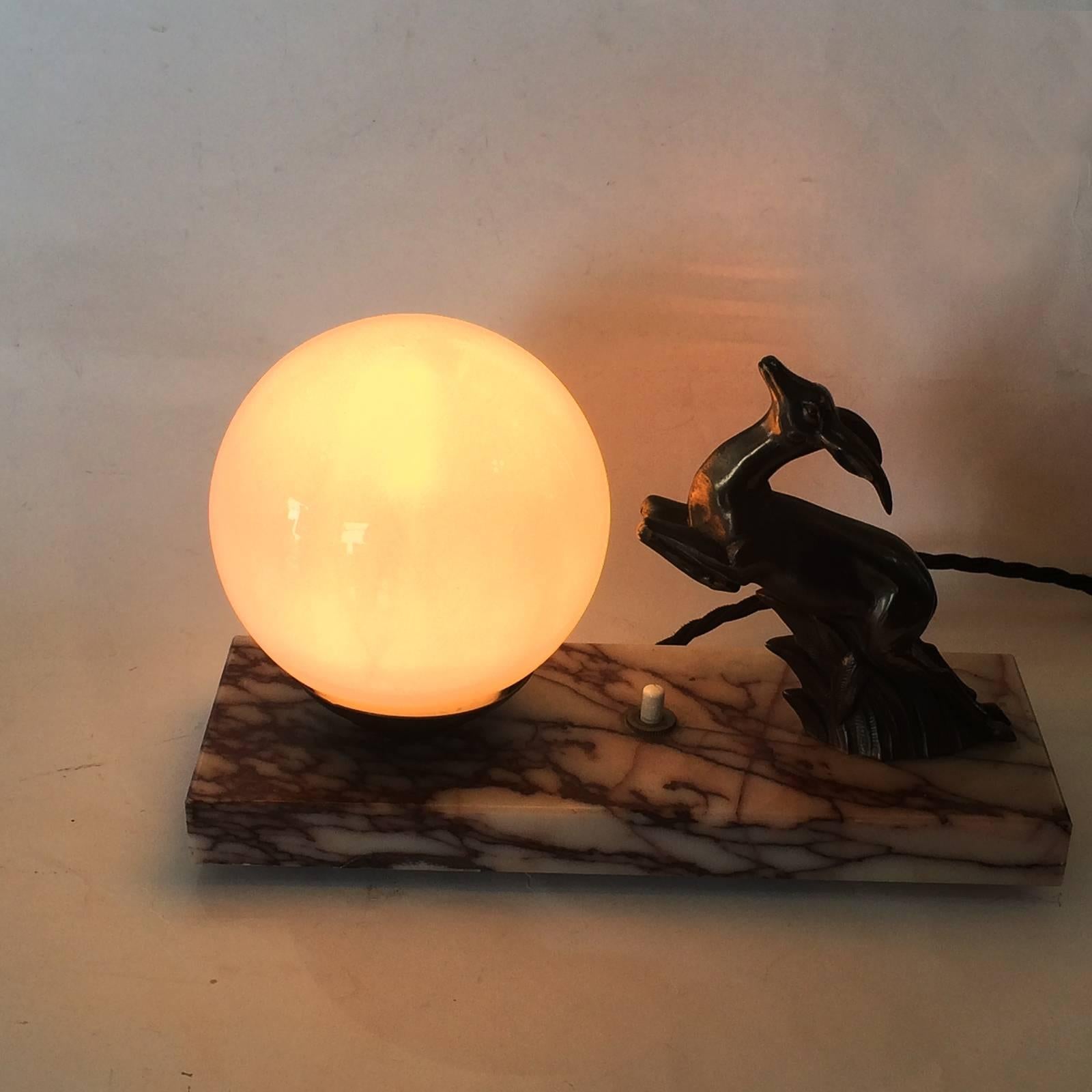 Art Deco mood lamp, with Font d' Arte Gazelle and white moon sphere glass shade and claret and white marble base. All in excellent condition, re-wired to current standards, but easily changed to suit U.S.A., Europe or U.K. The Gazelle Fonte D' Arte