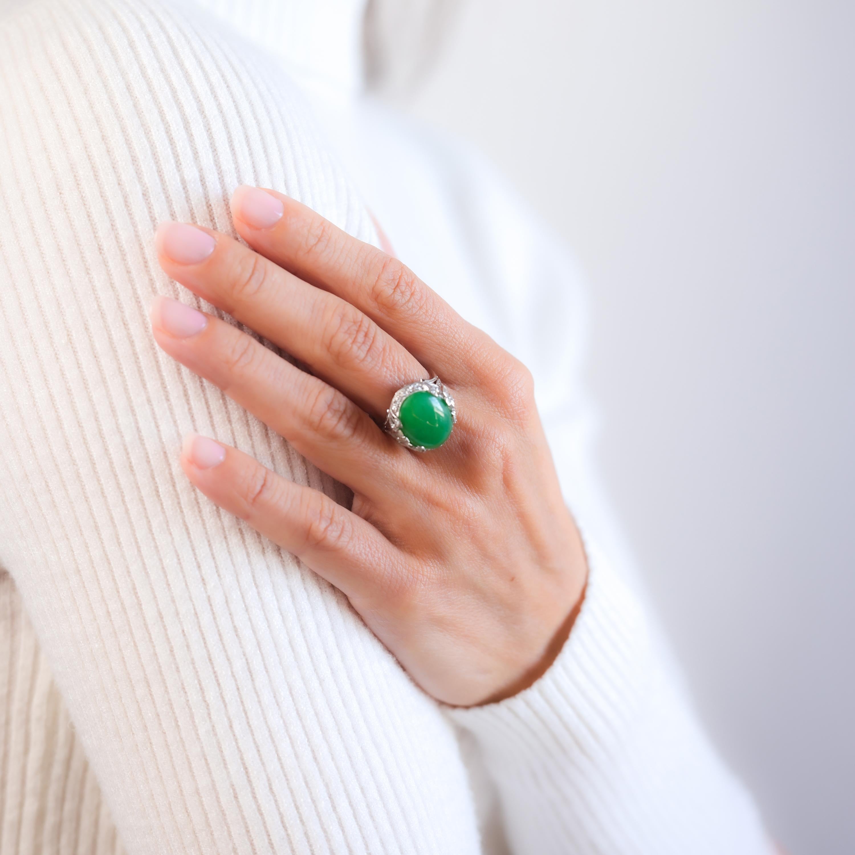 Certificate: GIA  #2235391624
Center Stone: Oval Double Cabochon Cut Green Jade
Weight: Approximately 8.8 Carat
Treatment(s): No Indications of Dye or Impregnation
Accent Stone: 10 Baguette, 34 Single, and 14 Round Brilliant Cut Diamonds
Total