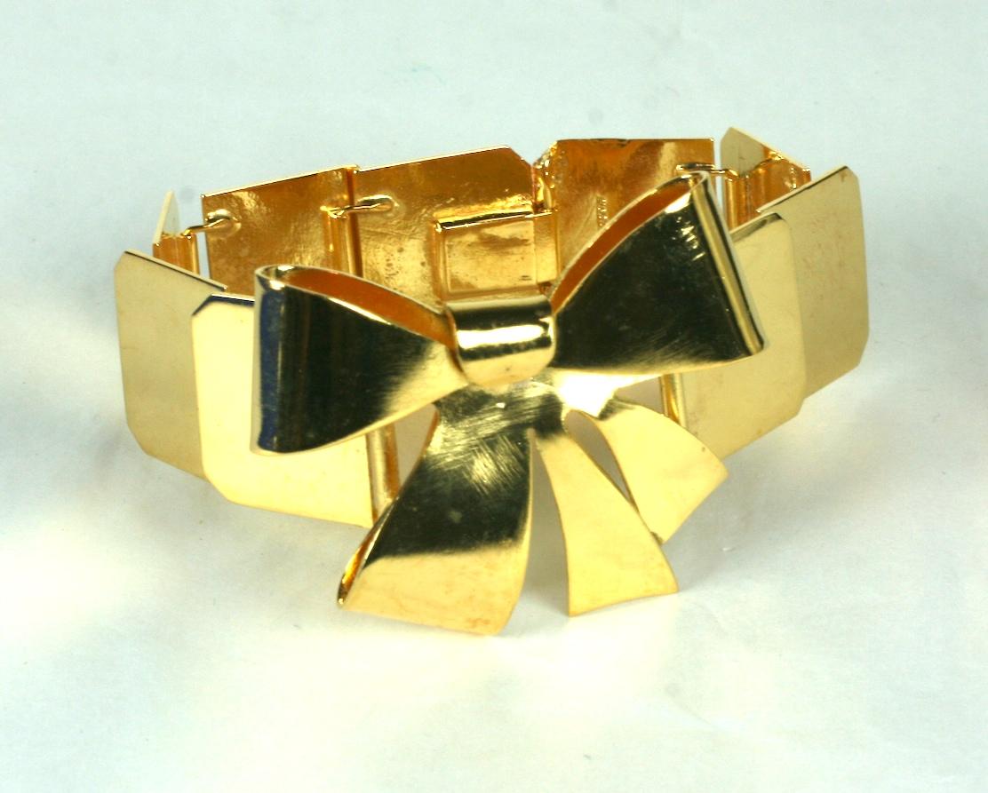 Art Deco French Gold Bow Knot  Bracelet. Composed of high polished gold plated overlapping rectangular links. Focal hand cut and looped three dimensional bow knot.
Excellent Condition, Marked Made In France. 
 Length  7 .50