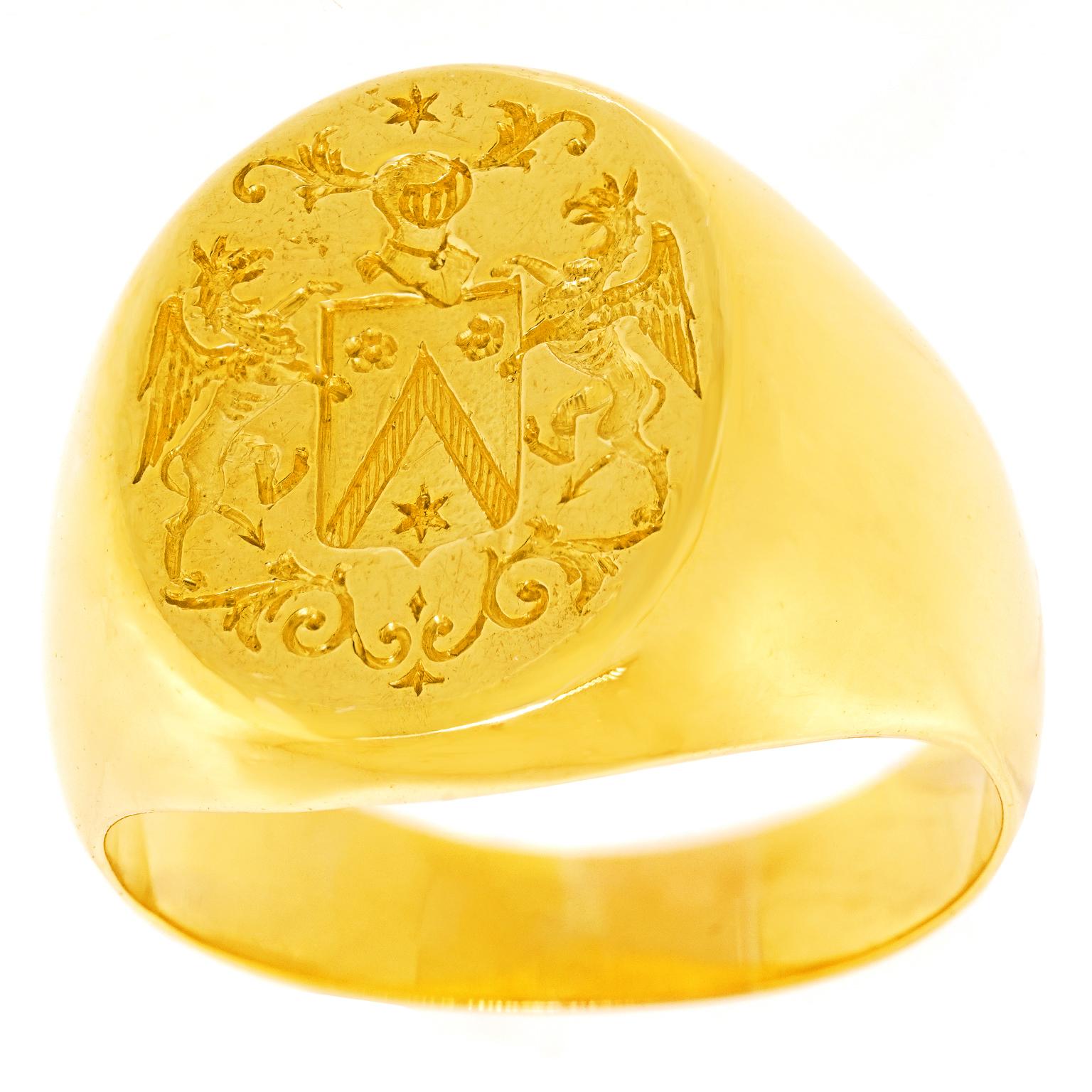 Circa 1920s, 18k, French. Decorated with a fabulous armorial, this French Art Deco signet ring has a charming town and country look. Classic lines, heavy gold, and a balanced scale make this a perfect everyday signet ring. Beautifully made, it is in