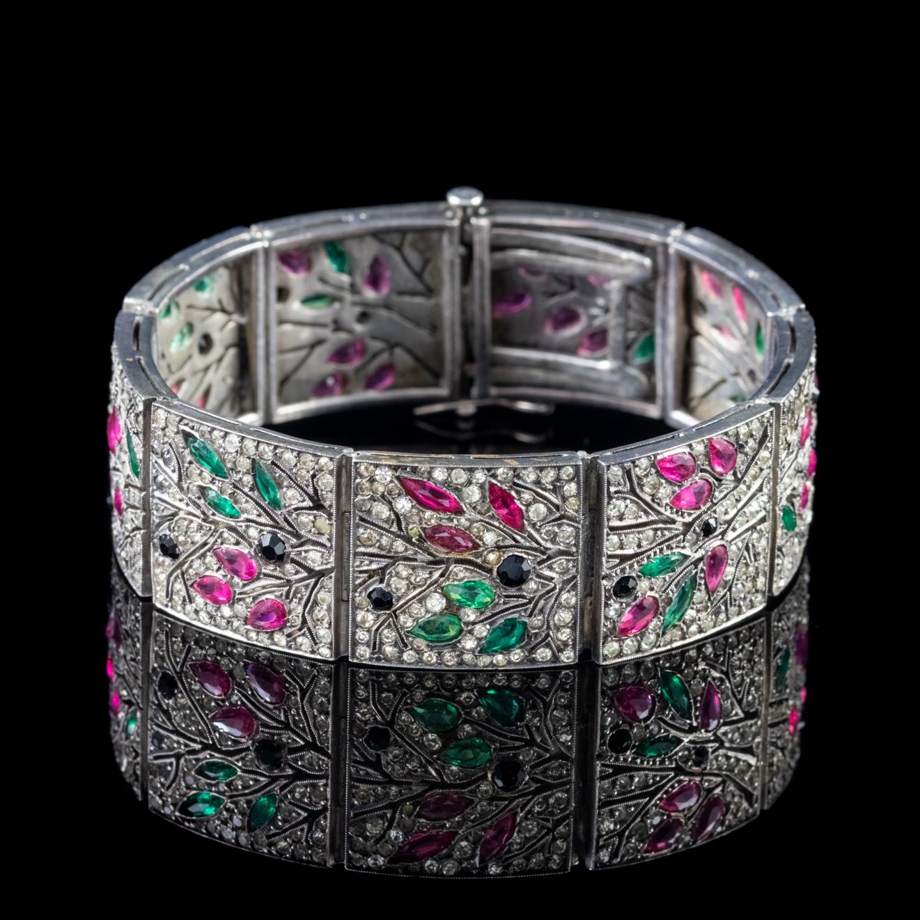 An exquisite French bracelet made during the Art Deco period, Circa 1920. The piece is modelled in Sterling Silver and decorated with sparkling white Paste Stones. 

Paste is a transparent flint glass that simulates the fire and brilliance of
