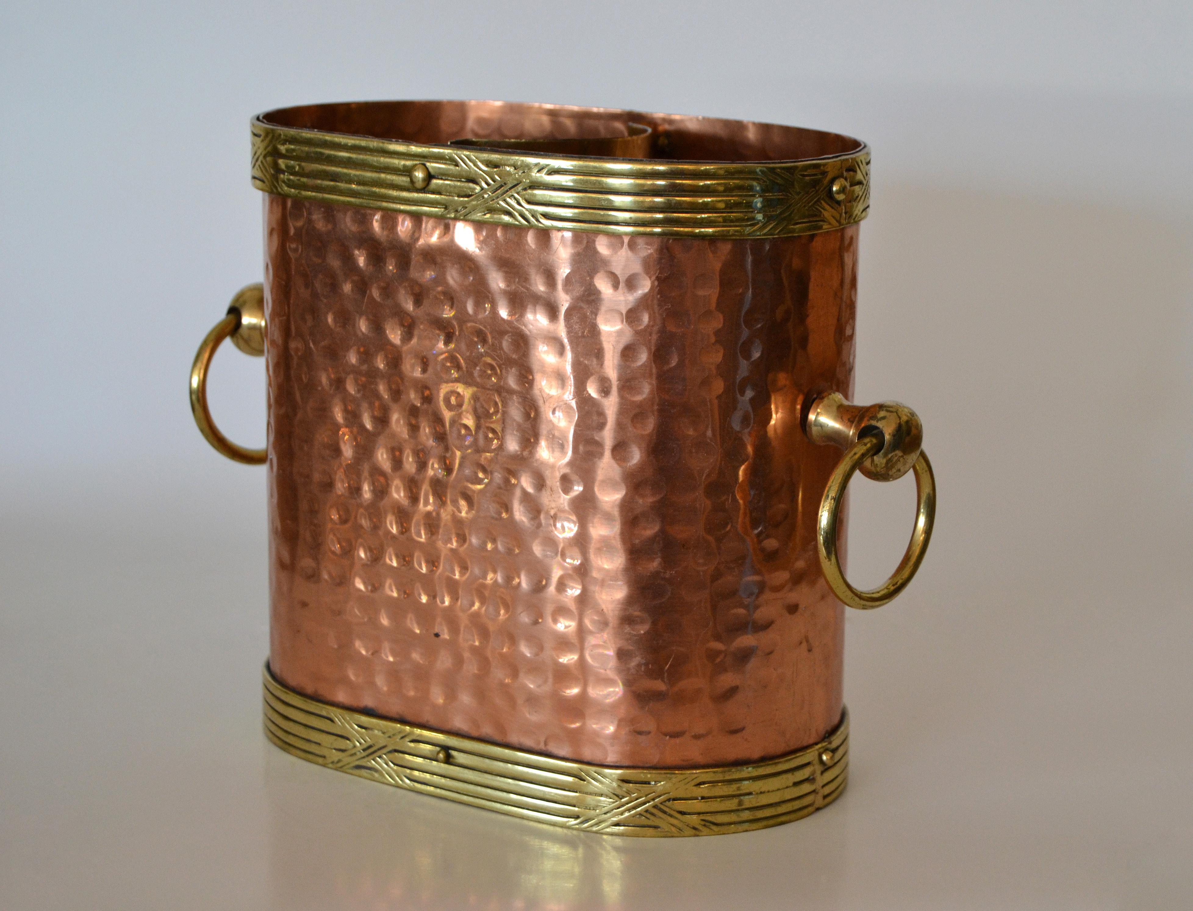 French Art Deco hand-hammered copper, brass and bronze detail Champagne ice bucket or Wine Cooler.
A formfit divider inside the bucket for the single Champagne bottle.
Heavy and great quality craftsmanship.
Perfect also as a wine cooler for Your