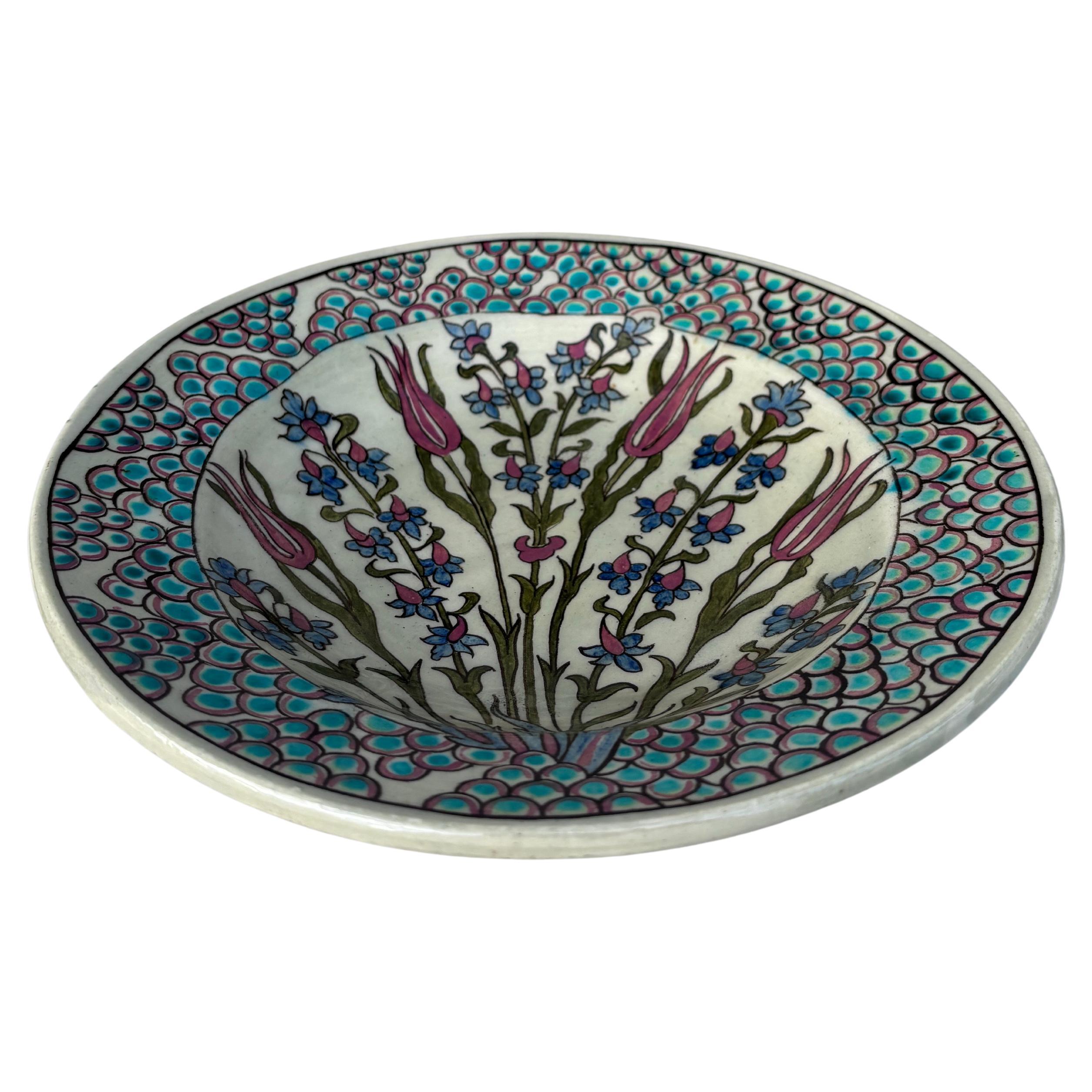 Art Deco French Iznik Platter Bowl Jean Jacques Lachenal.
Floral pattern ,red  tulips and blue flowers.
Geometrical border.
Diameter / 9.8 inches 
H / 1.8 inches.
Jean-Jacques Lachenal (1881-1945) was a potter who made earthenware dishes and