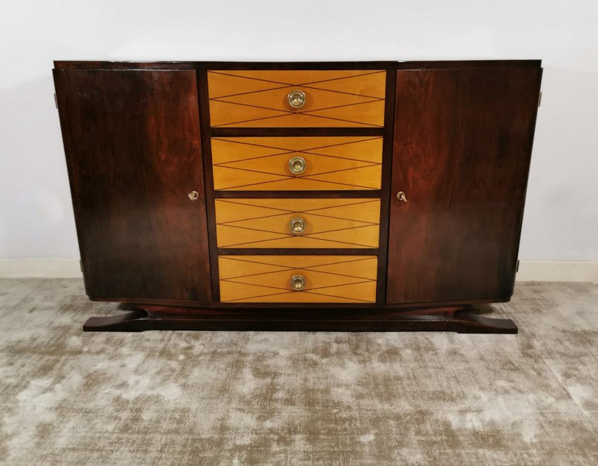 Art Deco French sideboard in polished mahogany, the four drawers are in birch with geometric inlay, the brass knobs are original, produced in France in 1930. Measures: 140 x 43 H.85.