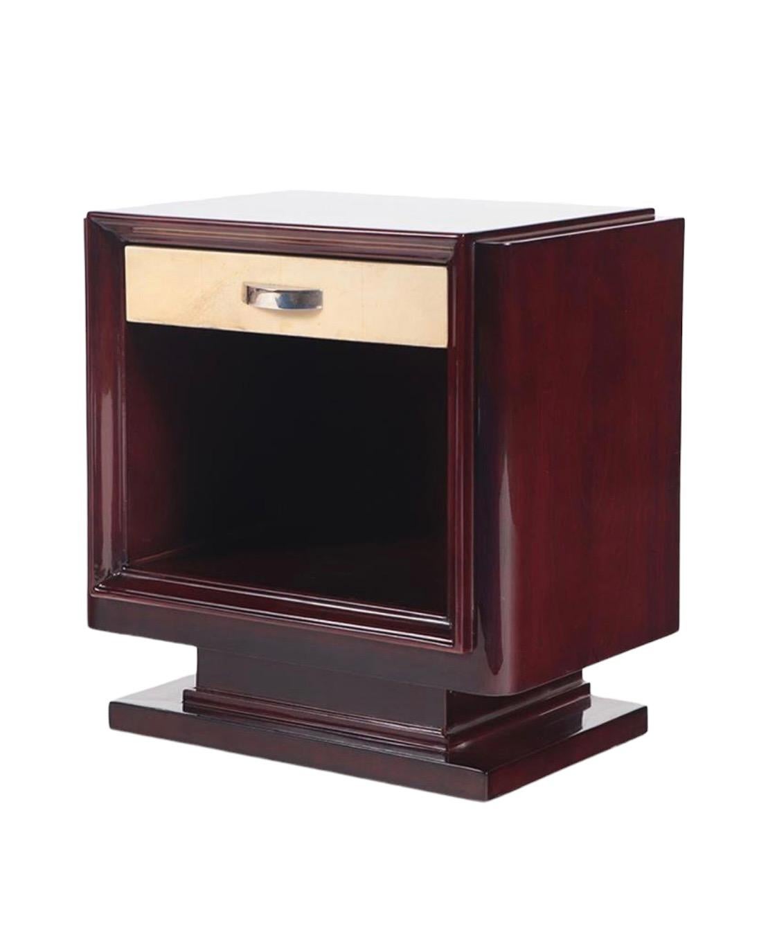 Behold a captivating duo of French Art Deco nightstands, crafted circa 1930, where the allure of mahogany meets the opulence of goatskin. These nightstands are distinguished by their modest proportions and the hallmark clean lines of Art Deco