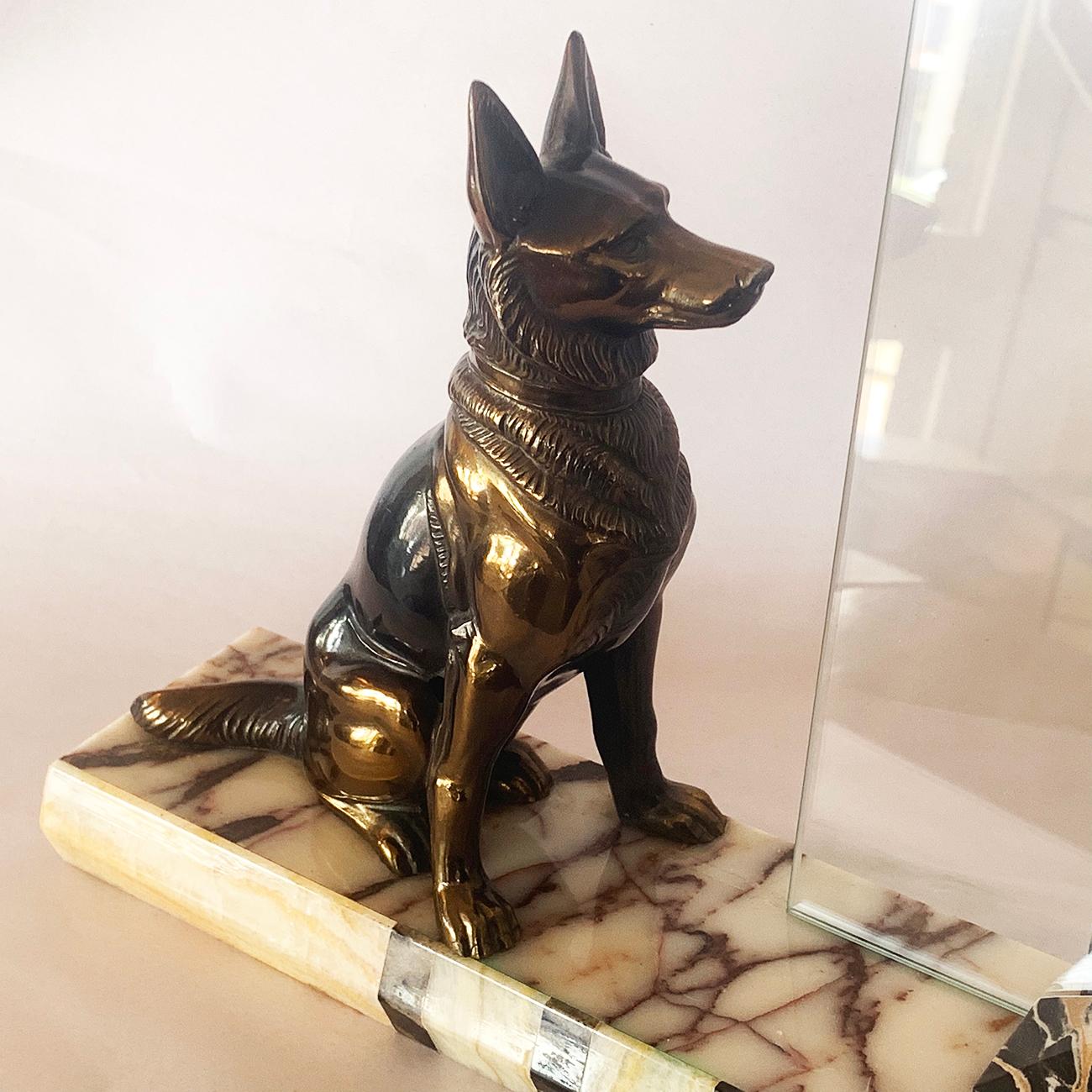 Art Deco photo frame with Alsatian dog as feature, on a marble and onyx decorated base. The photo glass is supported and both pieces are held together with the famous Italian Potorro marble that is also used to decorate the front bevelled edge as