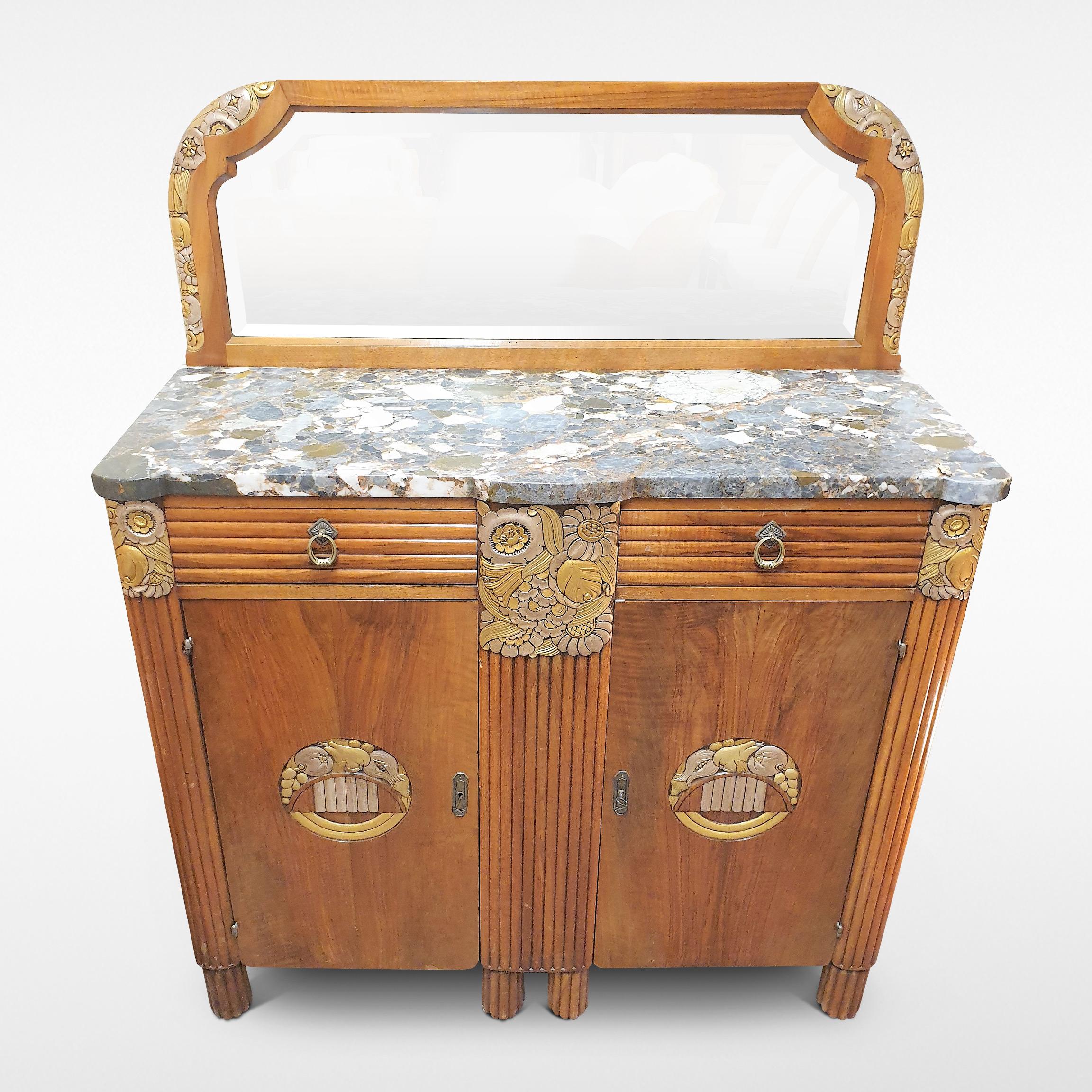 Art Deco French marble-top walnut sideboard with gilt carved detailing and reeded drawer fronts, circa 1930.