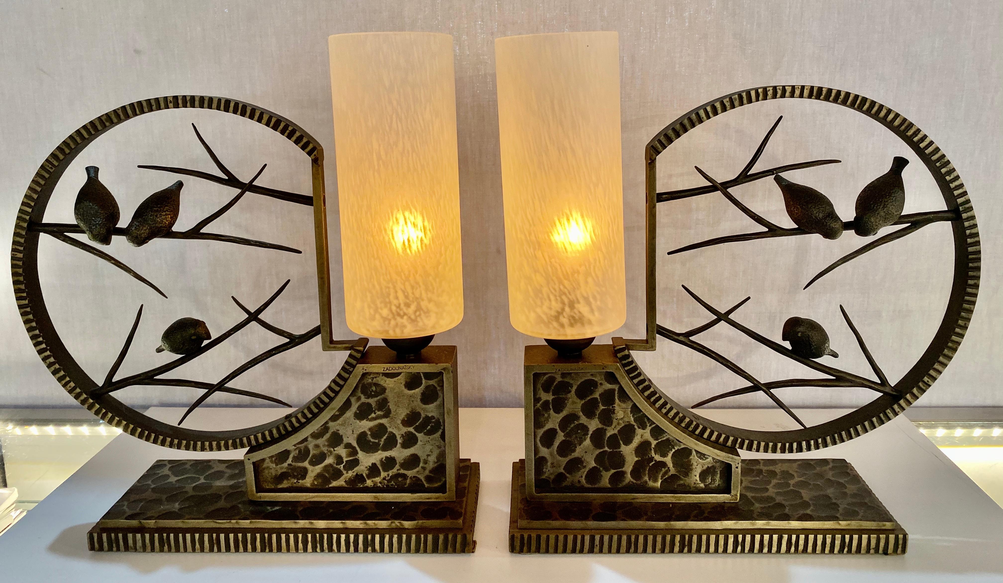 Art Deco French Michel Zadounaisky table lamps. A pair, circa 1930s. These simply stunning and amazing table lamps depict birds in a circular cage by Michel Zadounaisky, France, 1930s are quite possibly the finest of this designers work. The pair