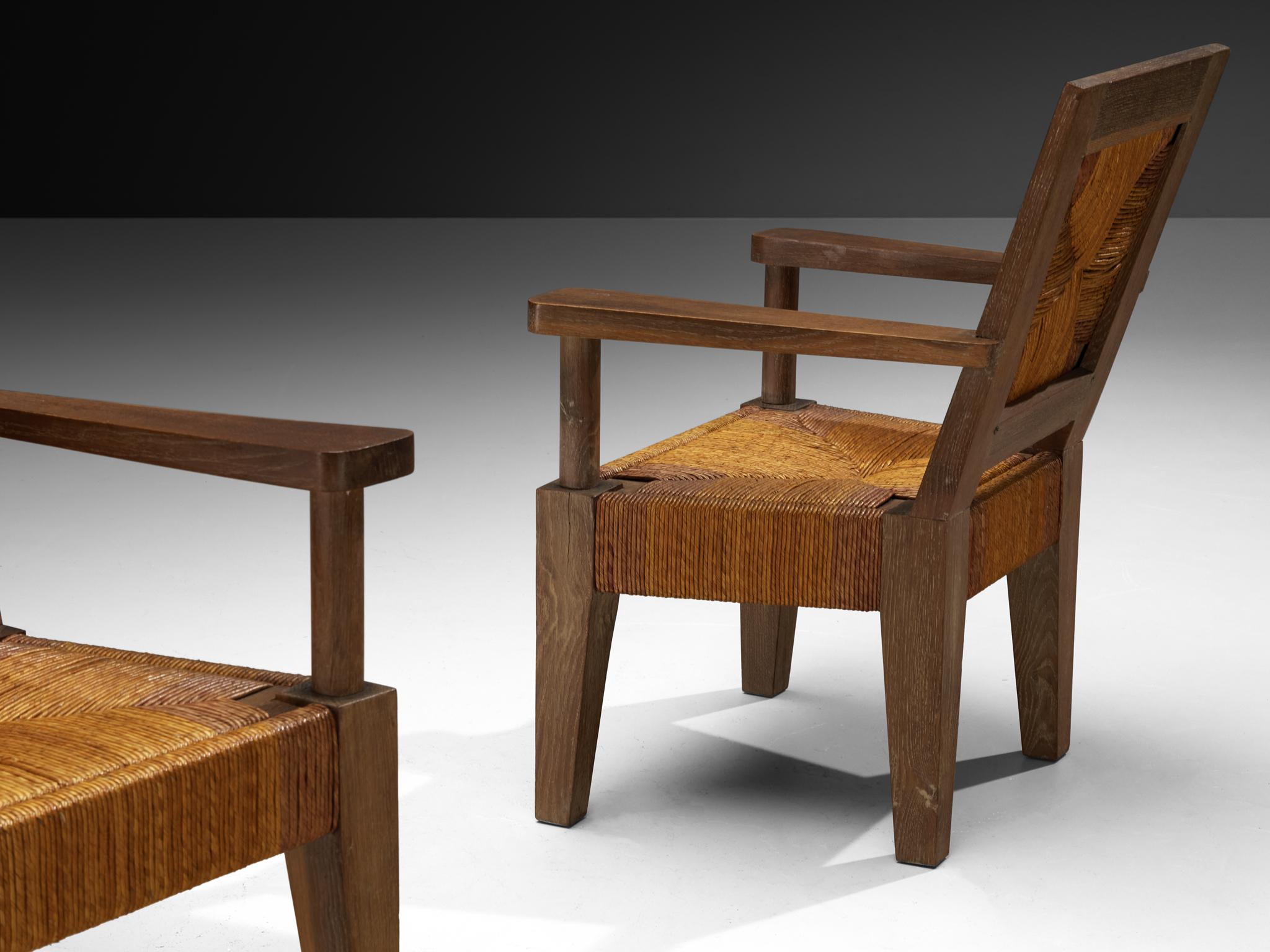 Français Fauteuils monumentaux français Art Déco en chêne et jonc en vente