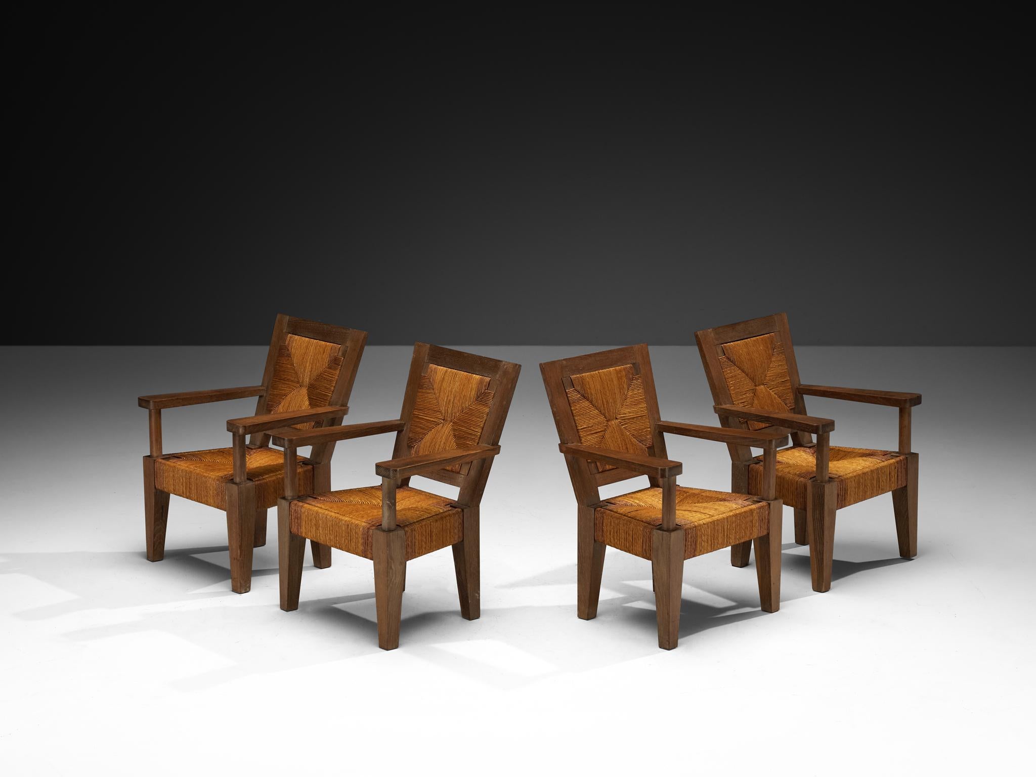 Fauteuils monumentaux français Art Déco en chêne et jonc Bon état - En vente à Waalwijk, NL